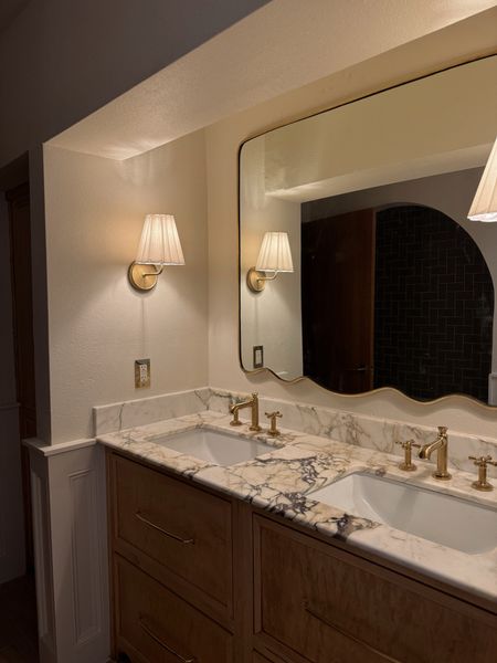 Scalloped mirror (hung upside down), sconces 

#LTKhome #LTKstyletip