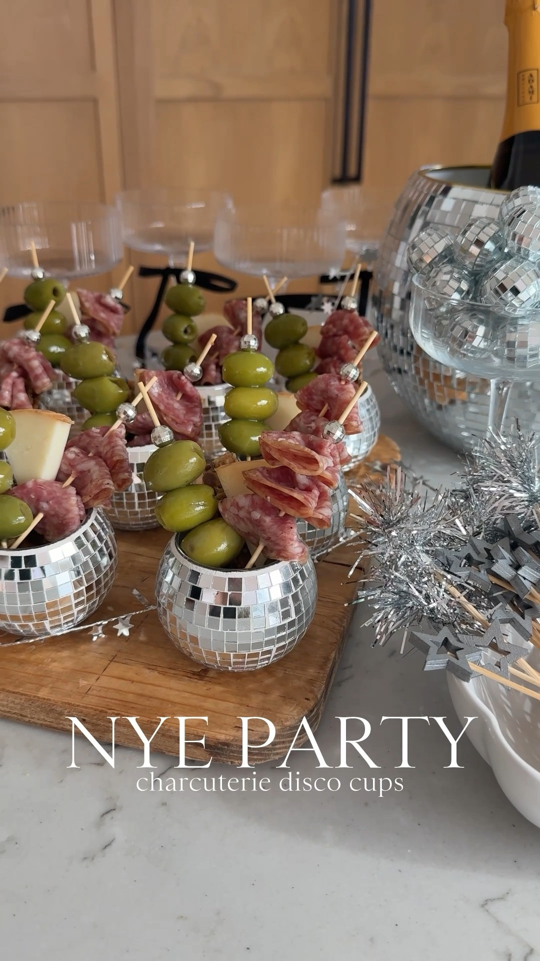 NYE party mini charcuterie disco cups🪩🪩 I’m all about staying home to ring in the new year BUT let’s make it cute!!💫 Celebrate with a little app and bubbly!!🍾 These are SO easy to put together. I found these mini ceramic cups on Amazon along with the disco ball picks - perfect for olives and meat!!🫒 

#LTKHome #LTKHoliday