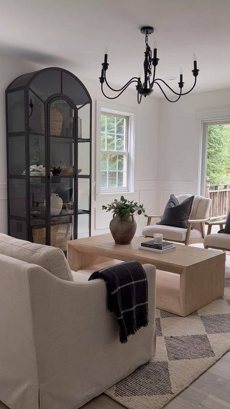 As seen in reels! Living room sources! Arch cabinet, sofa, linen sofa, arm chairs, target, Walmart, coffee table, Amazon, farmhouse chandelier, lamp, vase, decor. 

#LTKhome #LTKSeasonal #LTKstyletip