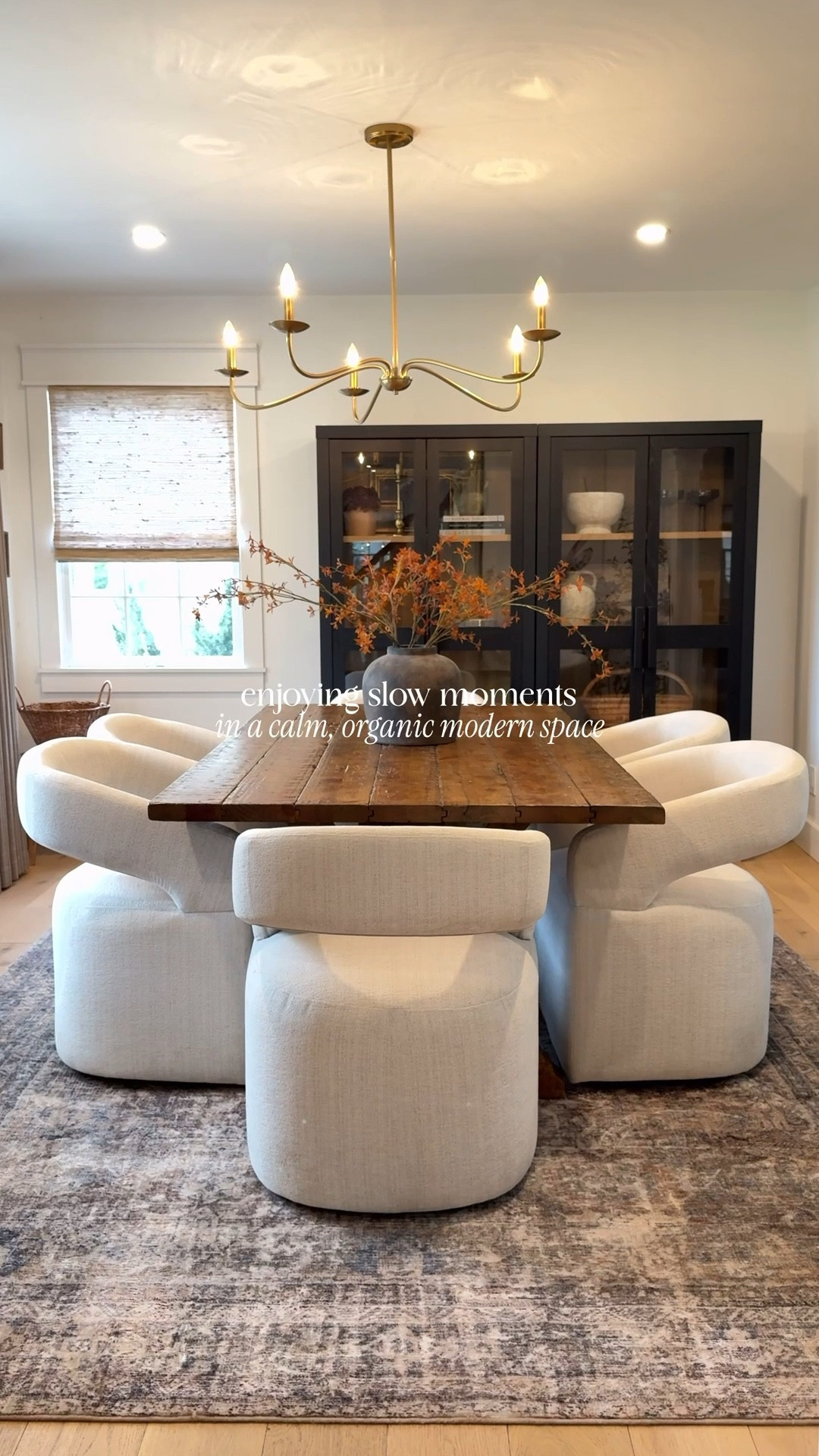 This organic modern dining space blends a rustic wood table, timeless lighting, and upholstered dining chairs for that elevated yet inviting feel. These affordable black storage cabinets tie it all together—proof you don’t need to overspend to create a warm, stylish space. 🤎

#LTKHome #LTKvlog #LTKSaleAlert