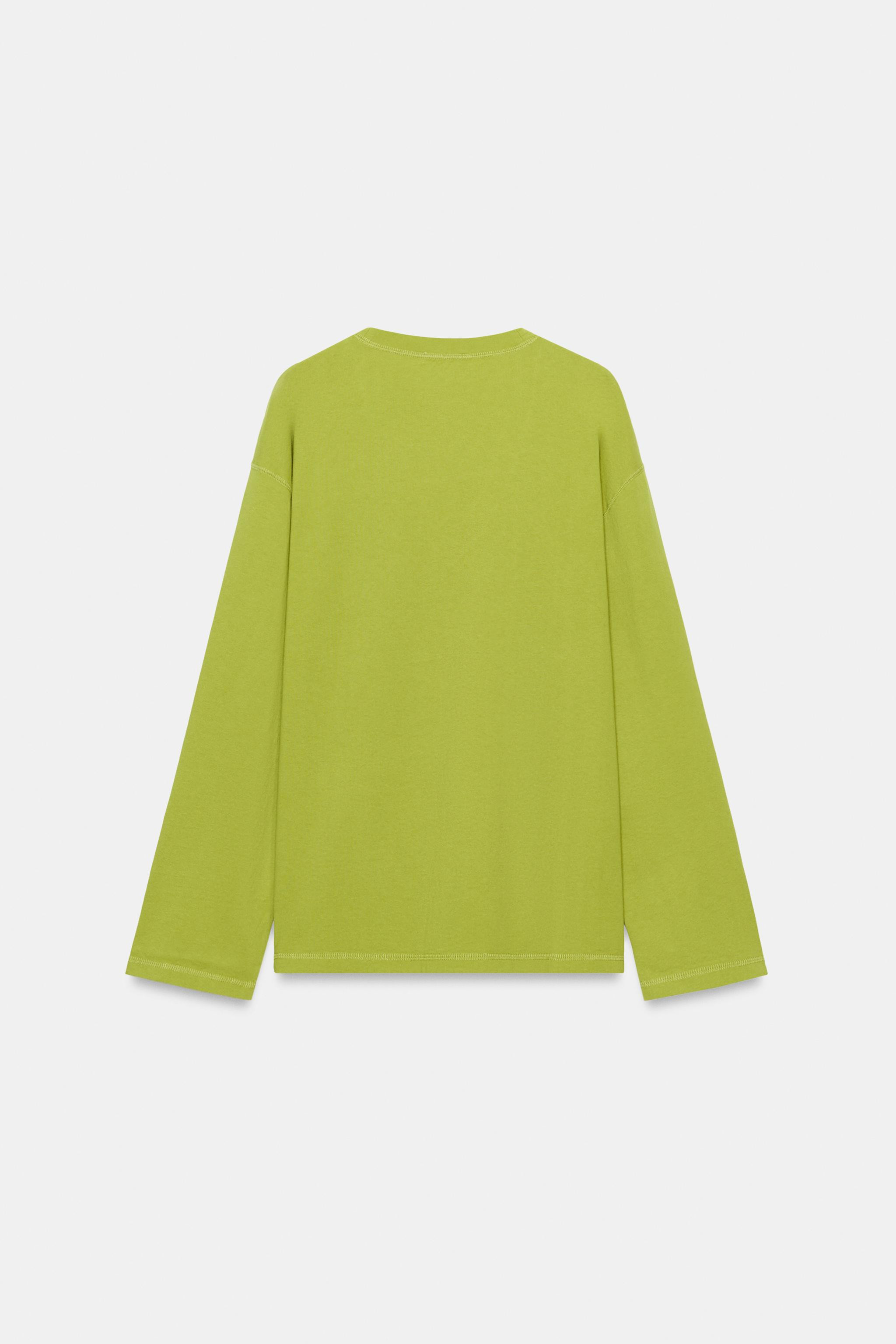 Regular fit, V-neck, standard length, long sleeves. This T-shirt is crafted from premium cotton y... | Zara US