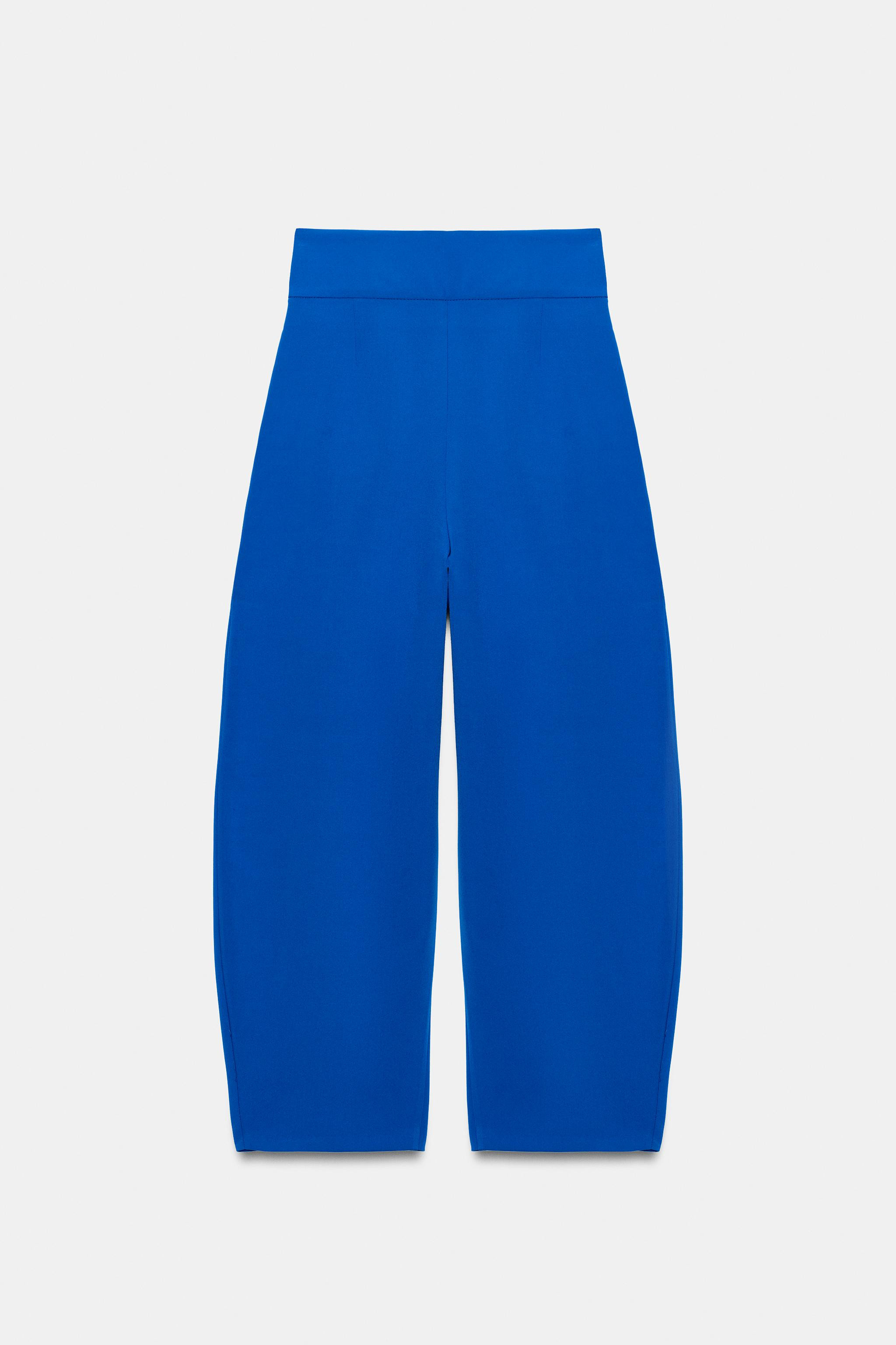 High-waist trousers crafted from viscose. Featuring front pleats and hidden side seam pockets. Fa... | Zara UK