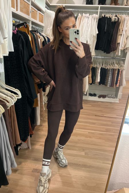 all brown athleisure fit 🤎 this sweatshirt fits oversized + perf to pair with leggings! Size small in everything 

Varley, activewear, athleisure, brown leggings, new balance, new balance 9060, sneakers, fall activewear, fall athleisure, comfy outfit, travel outfit 

#LTKstyletip #LTKfindsunder100 #LTKfitness