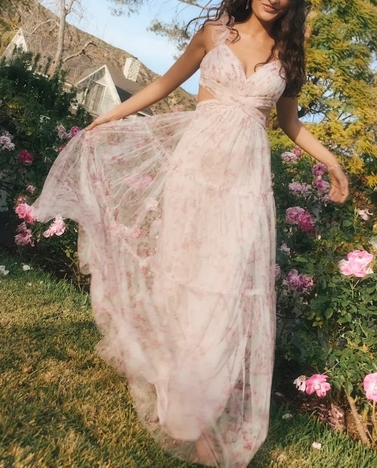 This blush floral maxi dress moves with a soft, airy elegance defined by pleated tiers and a flattering tie-back design. The floral pattern adds a graceful touch while maintaining a polished, elevated finish. Under $140.

Keywords:

* floral maxi dress
* blush maxi dress
* pleated maxi dress
* tiered maxi dress
* tie back dress
* wedding guest dress
* garden party dress
* romantic maxi dress
* feminine floral dress
* summer maxi dress
* elegant maxi dress
* flowy occasion dress
* spring dress outfit
* resort wear dress
* statement maxi dress

#LTKgrwm #LTKootd #LTKWedding