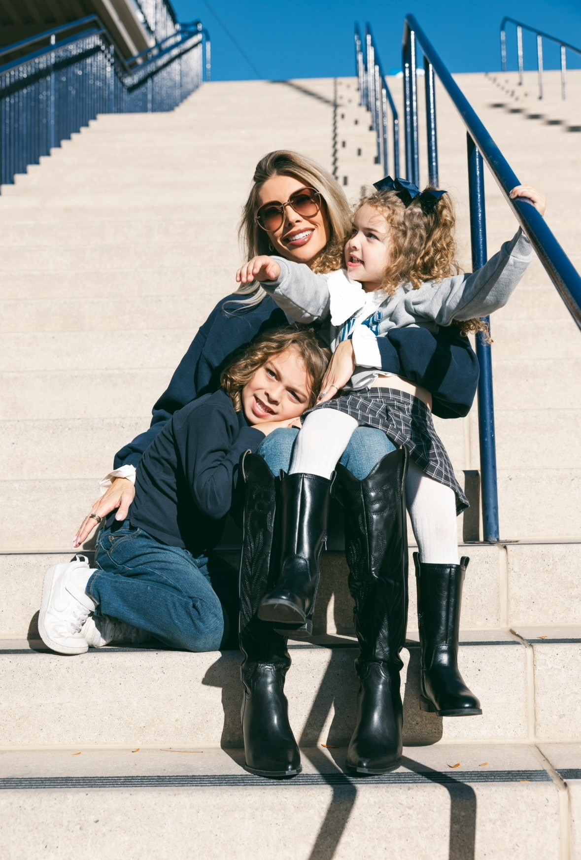 Love showing our babies where our love story began. 💙 BYU sweatshirt is my mom's from when she was in college, but I linked some similar collegiate vibes no matter your team. My collared shirt is by Ronny Kobo. It's actually genius because I got the look of the exaggerated collar and cuffs but the mesh made it not crunchy or bulky under my sweatshirt. My sunglasses are Chloe. My jeans are Polo, linked exact and similar. My tall black leather cowboy boots are Oasis Society, linked similar. Linked both kids’ looks as well!

#LTKKids #LTKStyleTip #LTKFamily
