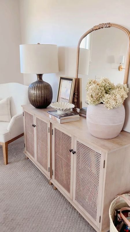 Cane cabinet, wood cabinet, home decor, affordable decor, furniture, terracotta pot, brass lamp, primrose mirror, neutral decor 

#LTKhome