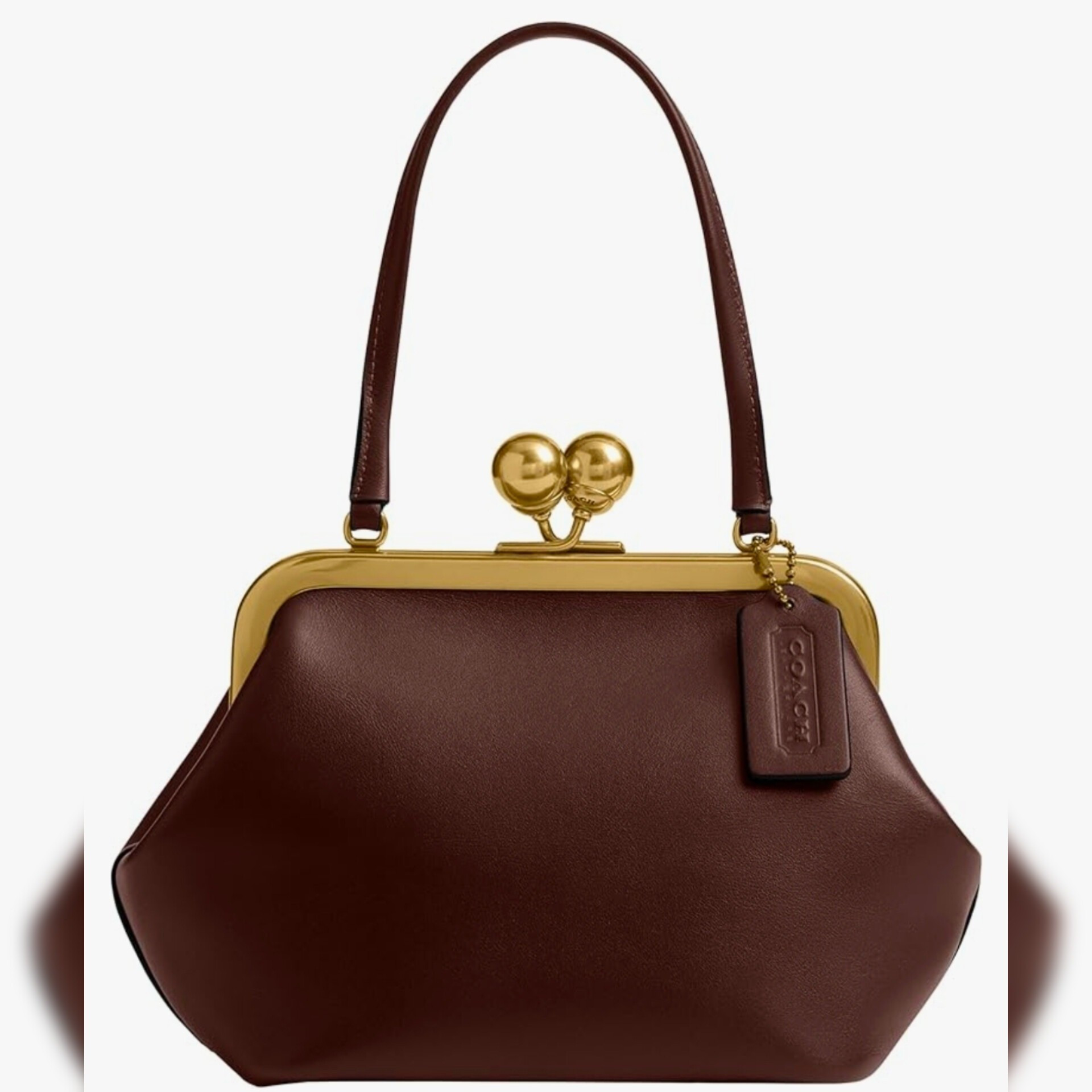 Coach Kisslock 16 in Maple is showing priced under $300 with coupon.

