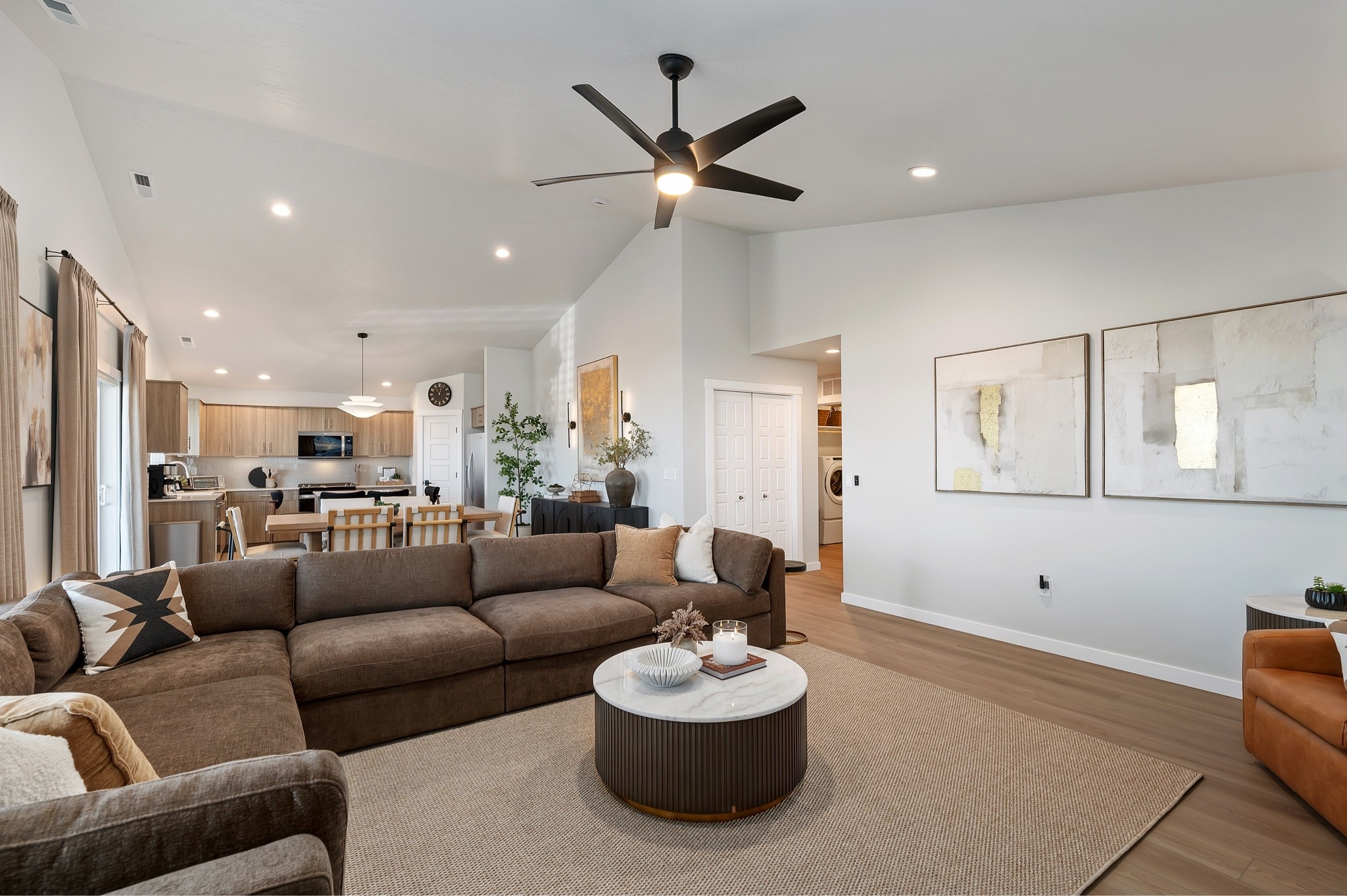 The mix of warm neutrals, layered textures, and clean lines gives this living room a relaxed, elevated feel. The oversized sectional keeps it comfortable, while the round coffee table, woven rug, and soft artwork add warmth without making the space feel busy.

The black ceiling fan and dark accents also add just enough contrast to keep the room feeling balanced.
@Wayfair 
@Walmart

#LTKU #LTKSaleAlert #LTKHome