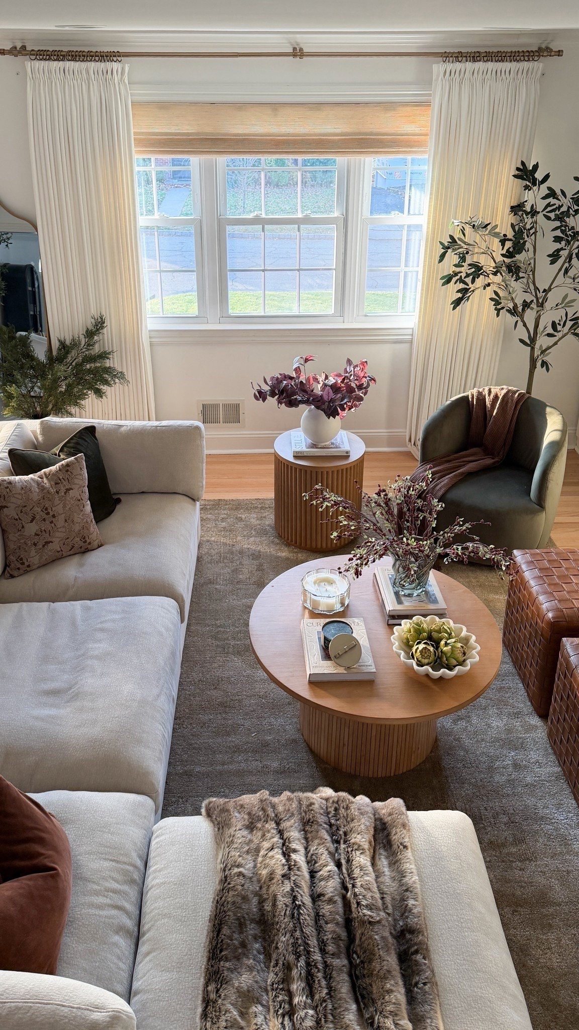 Somehow this room becomes the heart of our home every holiday season 🤎
It’s where the kids pile onto the sofa with blankets, where we sip coffee before the day gets loud, and where we end the night with Christmas movies and snacks we probably don’t need. 😍🙈

I wanted it to feel calm and layered, not overloaded — soft textures, warm wood tones, winter stems, and just enough seasonal touches to make it feel special without changing everything.

#LTKHoliday #LTKSaleAlert #LTKHome