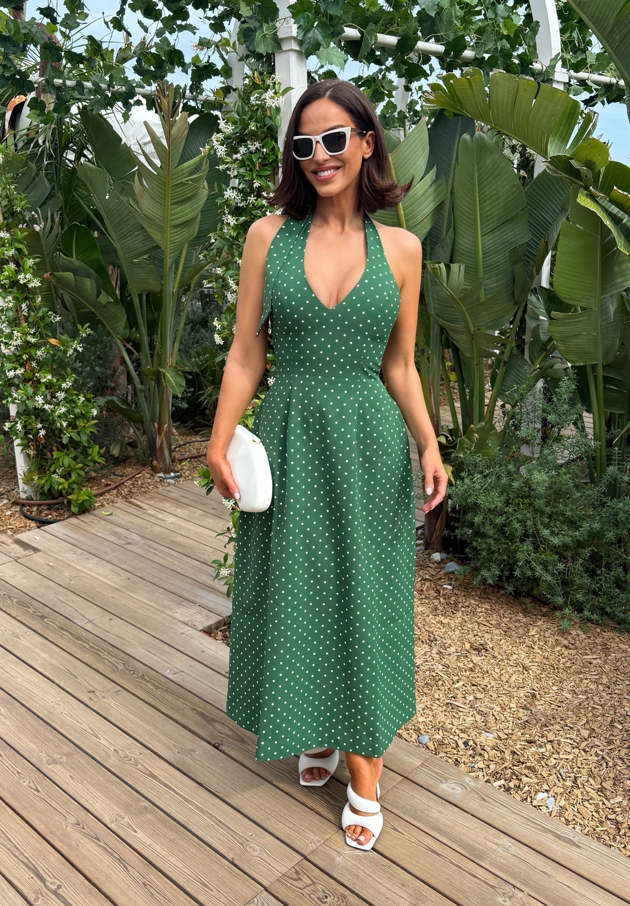 Halter neck, mid length, green polka dot dress from odd muse.

#LTKuk #LTKsummer #LTKdresses