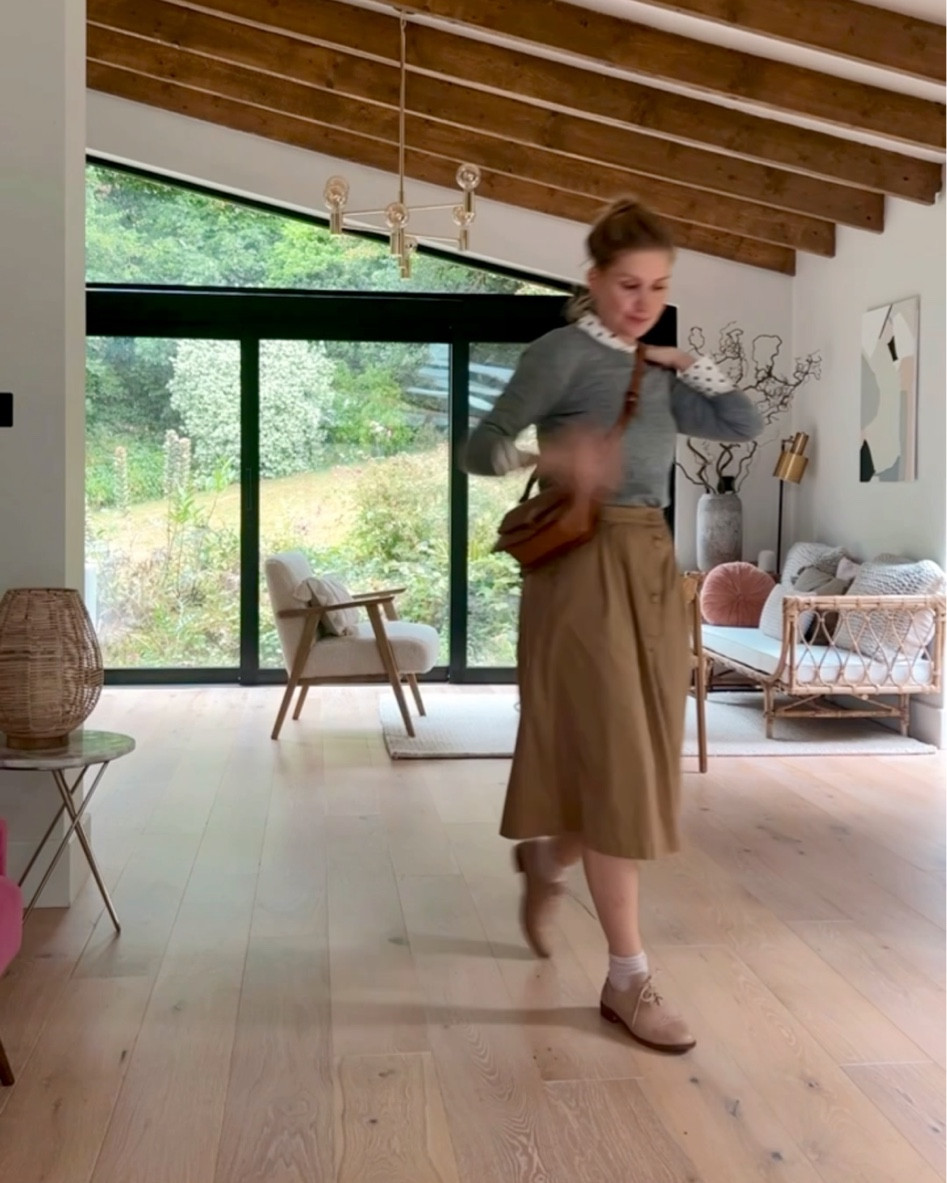 Midi skirt with a grey jumper and polka dot shirt #transitionalpieces #inbetween #wardrobebasics #styleinspo 