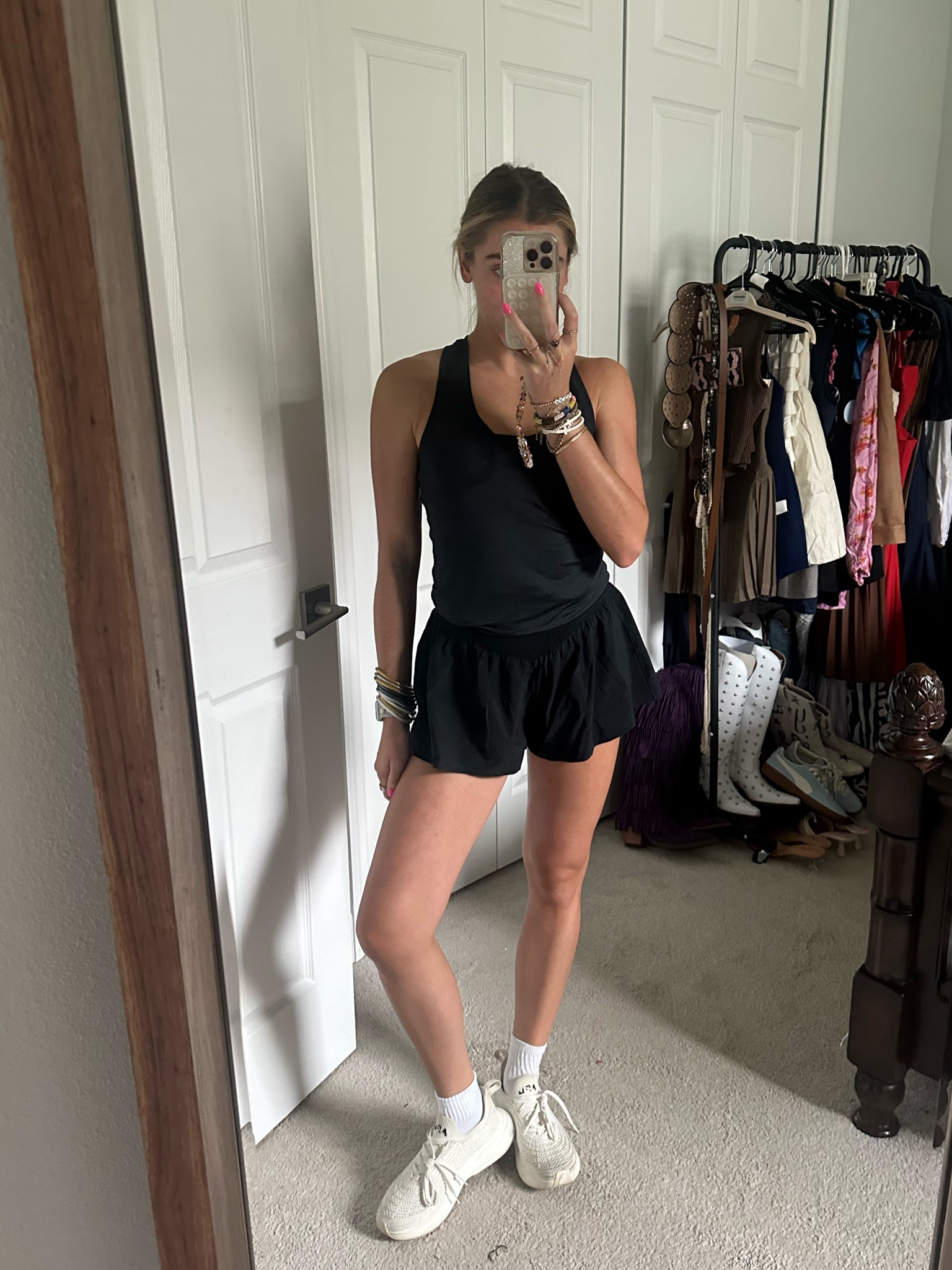 Rhoback: Link with code attached is https://bit.ly/43IgPot My coupon code: SV-F4B39E0JGH8Y. All black workout outfit. Black tank top. Black running shorts. APL white sneakers  

#LTKShoeCrush #LTKActive #LTKFitness