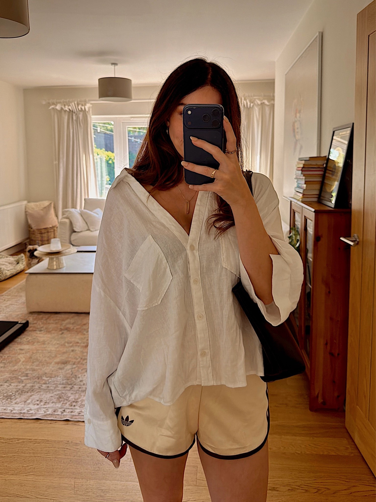 Oversized linen shirt, adidas shorts and my most used bag rn 🤍

Outfit details:
🤍 Zara oversized linen shirt (true to size, sized up for the slouchy fit)
🤎 Adidas Originals sprinter shorts (comfiest shorts I own, wearing true to size)
👜 Mango tote bag (the one bag I reach for every single day)

Easy uniform for summer, throw the shirt over the shorts for the school run, take it off for actual heat. Everything linked and shoppable on my LTK, all under budget pieces that work way harder than they cost.

#LTKstyletip #LTKfindsunder100 #LTKeurope