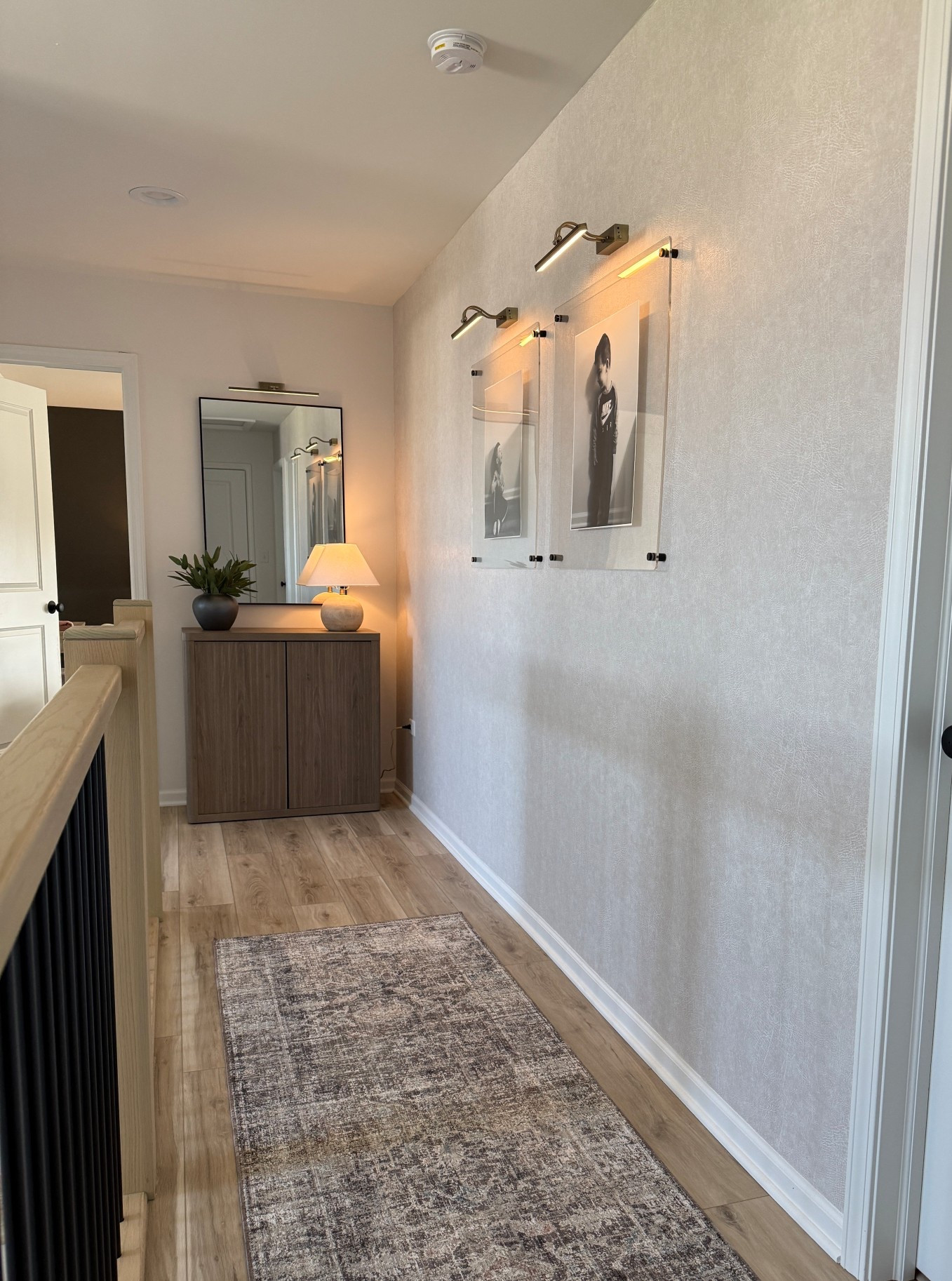 Hallway decor! The large wall is wallpaper (linked below) and I have 24x24 size framed with 13 inch picture lights. Runner is a 2-7x7 size


#LTKHome