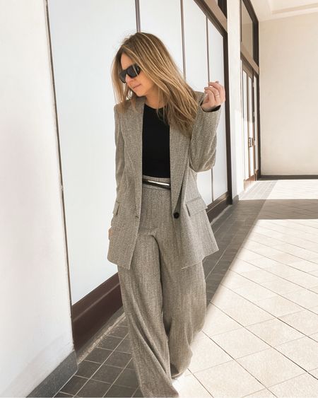 Pant suit work outfit in a neutral heather pattern. I styled it with a black fitted tee and a black wrap around tie belt. I also have white sneakers on with this but a classic black pump or ballet flat are other  options.

#LTKstyletip #LTKover40 #LTKworkwear