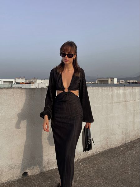 Black long sleeve maxi dress, black handbag, black sunglasses 

#LTKSeasonal #LTKstyletip #LTKeurope