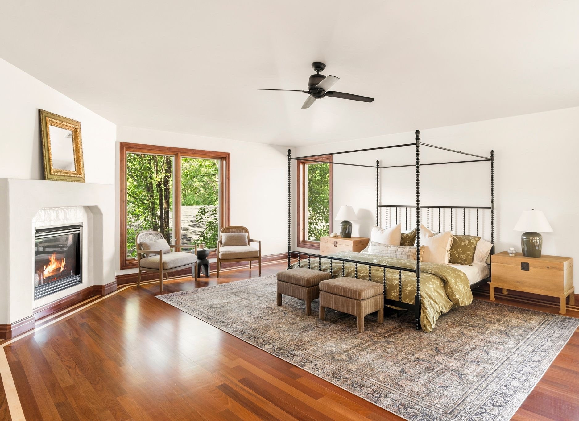 Spanish style bedroom with black metal canopy, vintage inspired rug, vintage side chairs and stripe ottomans. 

Bedroom, Spanish style, ottoman, side chair, vintage

#LTKHome