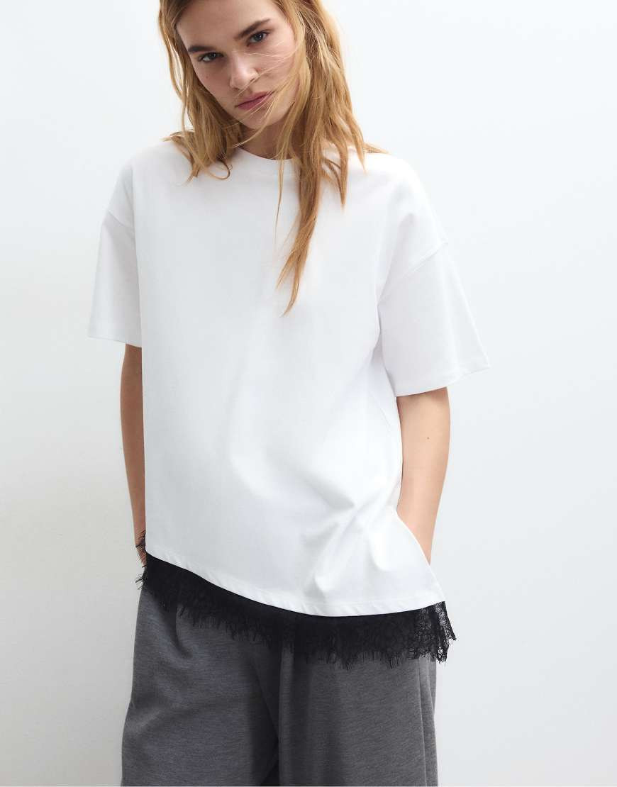 Stradivarius Short sleeve t-shirt with lace hem in white | ASOS (Global)