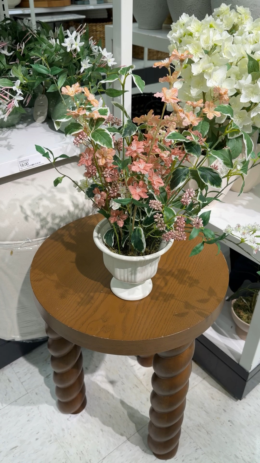 Cozy nook vibes with a fresh spring touch! 🌿🤎 I’m loving how the Braided Accent Table in warm walnut from Target brings texture and vintage charm, perfectly paired with the Wild Delphinium Floral Arrangement. 🌸 The airy pink and white florals instantly brighten any corner, while the footed fluted vase adds subtle elegance. ✨Together, they create a styled, inviting spot that feels both polished and effortlessly charming. Linked both pieces along with other similar home decor finds to shop! 🛍️ #TargetHome #HomeDecor #SpringDecor 

#LTKHome #LTKFindsUnder50 #LTKSaleAlert