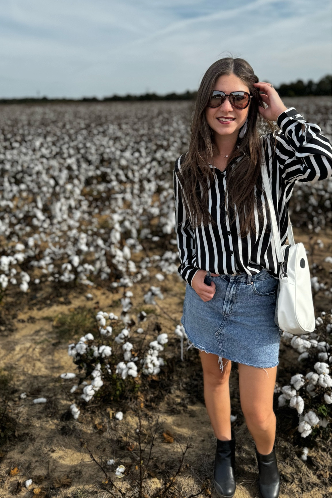 Cute fall outfit, black and white top, mini skirt style, black boots, and ghost purse 

#LTKSeasonal #LTKHalloween