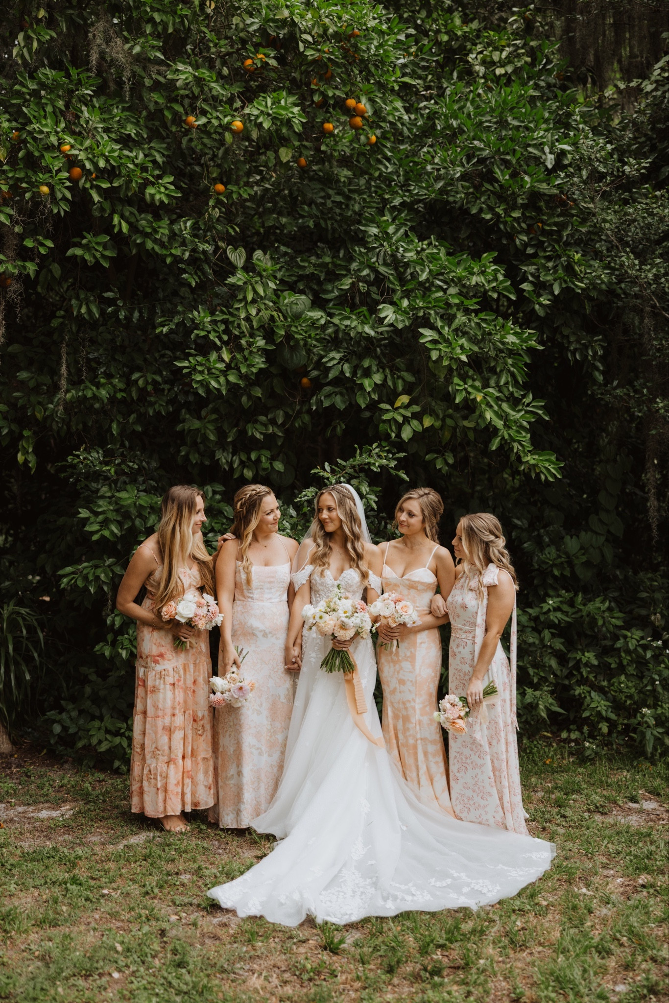Spring wedding with mismatched floral bridesmaids dresses in peach, blush, orange, and cream. 🌸

#LTKwedding #LTKstyletip