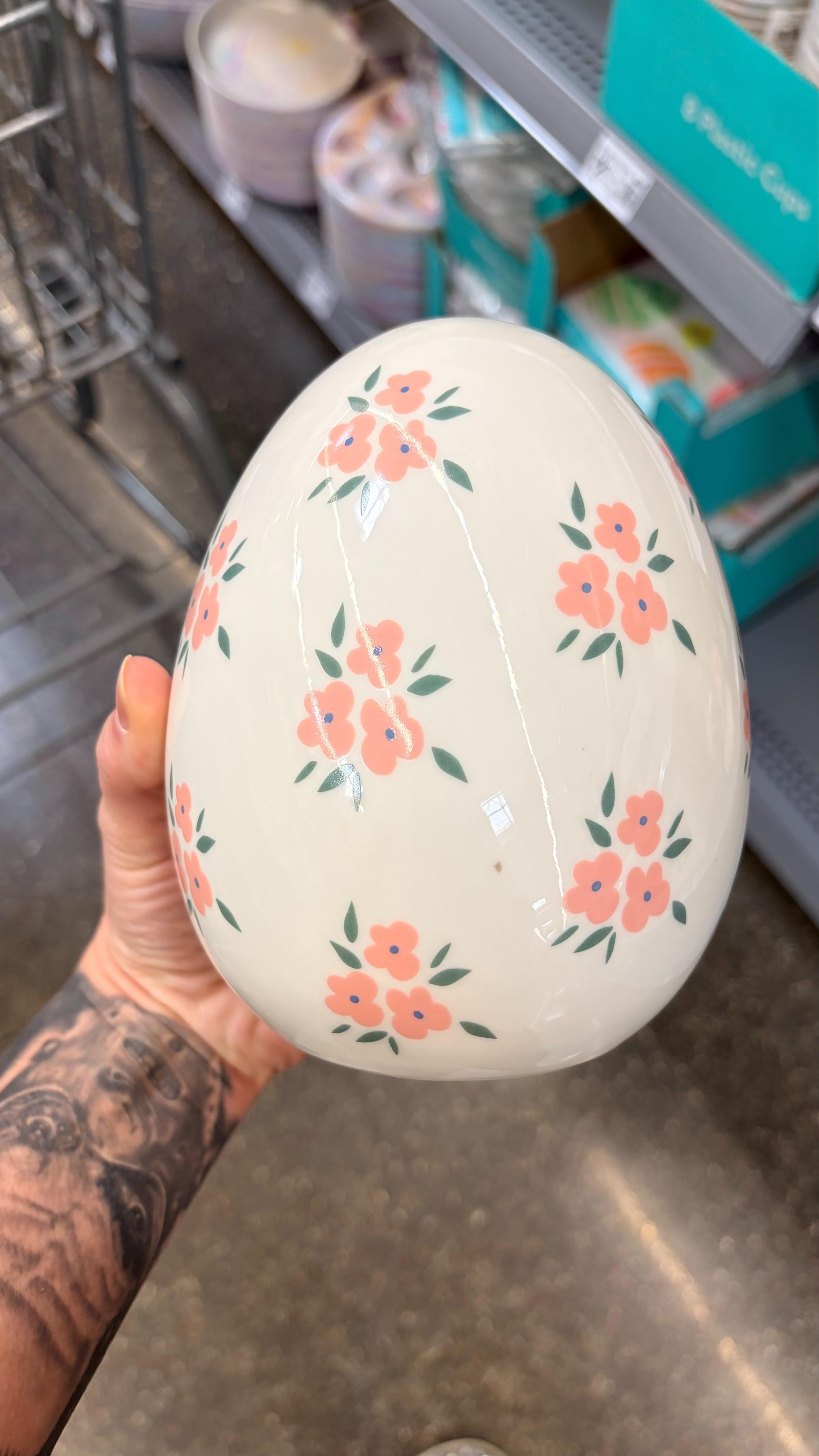 The My Texas House Ceramic Flower Easter Egg Decoration blends classic spring charm with timeless elegance. This six-inch ceramic egg features a glossy white finish adorned with delicate pink blossoms and soft green leaves, creating a look that feels both cheerful and refined. Its flat base keeps it steady on any surface, making it easy to display on mantels, tables, or shelves. Perfect for pairing with other seasonal accents, this piece brings a touch of garden-inspired beauty to your Easter decor. Celebrate the season in style with the My Texas House Ceramic Flower Easter Egg Decoration. 

 #LTKSeasonal #LTKHome