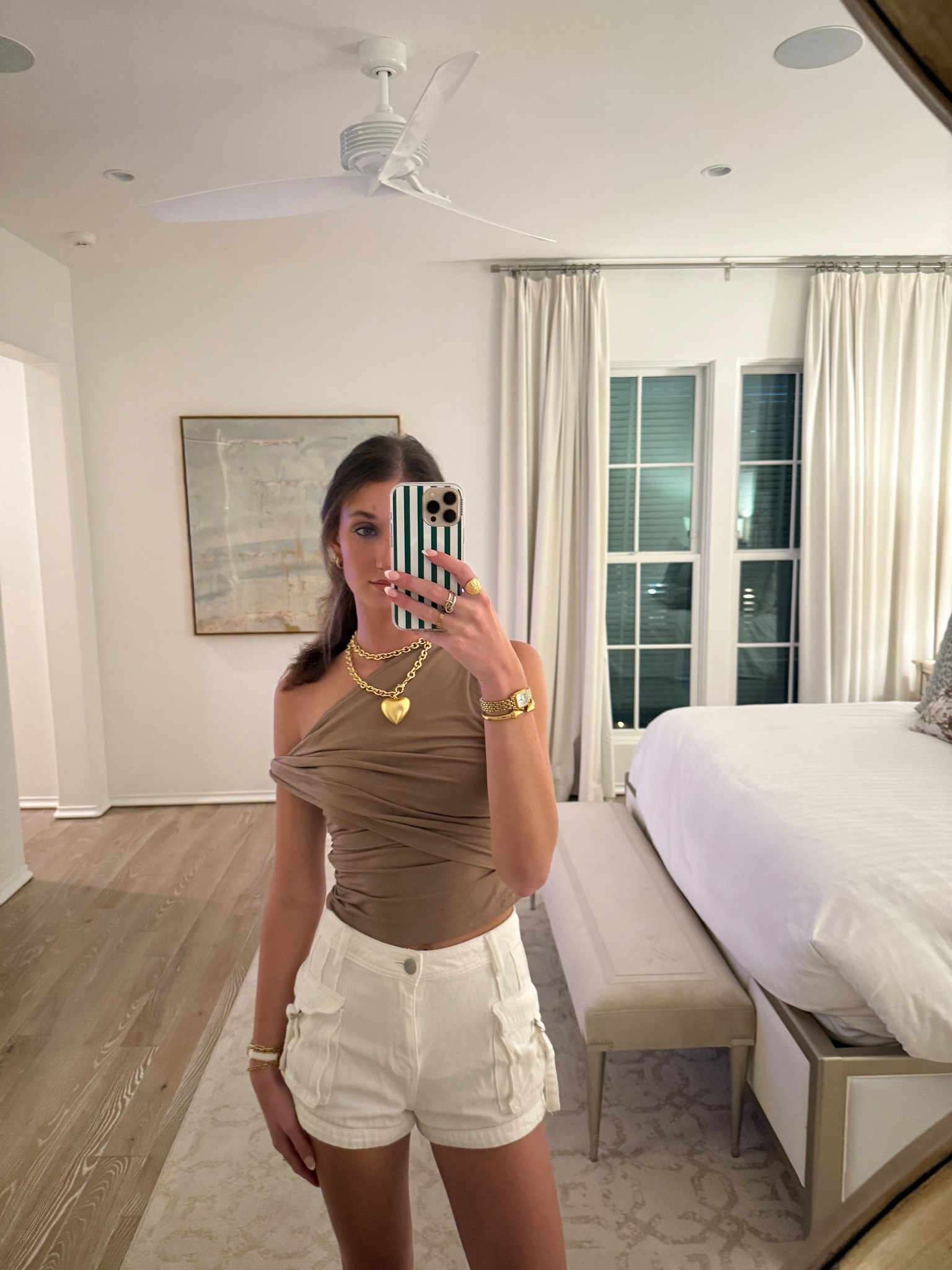 Mocha off the shoulder top superdown from revolve. White cargo denim shorts from superdown on revolve. Chunky gold heart necklace. Gold watch from amazon. Affordable fashion. Neutral outfit. Revolve finds. Amazon finds. Travel outfits. Vacation outfits. Beach outfit. Dinner outfit. Brunch outfit. Resort looks. Preppy outfit. Minimalistic outfit. 

#LTKTravel #LTKFindsUnder100 #LTKStyleTip