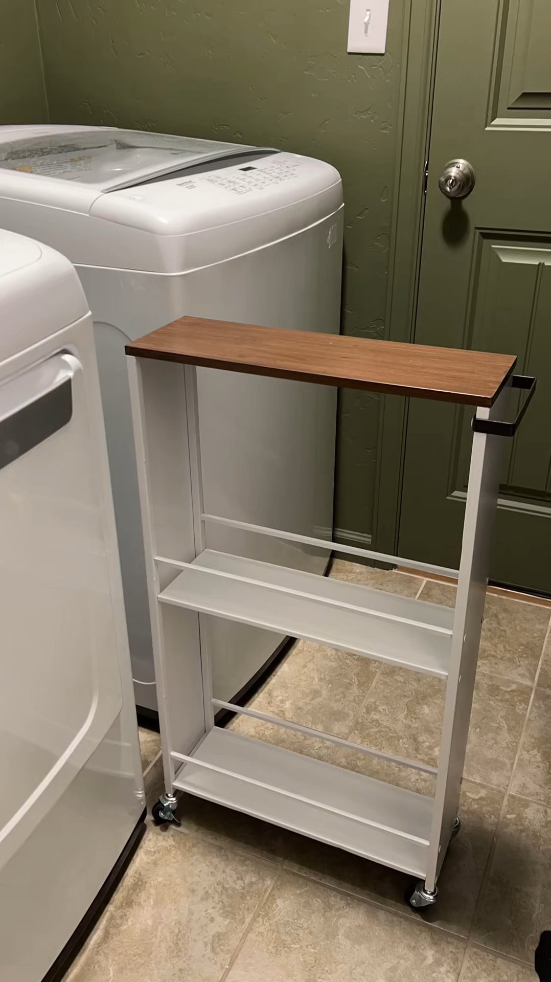 Laundry Room Update - Part 1

Removed the builder grade shelving and painted with @behrpaint in Mountain Olive. It’s perfect deep green 🤌🏻 

Also found this utility cart from @walmart. Our kitchen sink has a reserve osmosis system that takes up all the space, so this is a perfect place to store cleaning supplies 🙌🏻

diy laundry room update upgrade skinny thin storage cart makeover remodel renovation project dark green paint home decor ideas inspo

#LTKHome