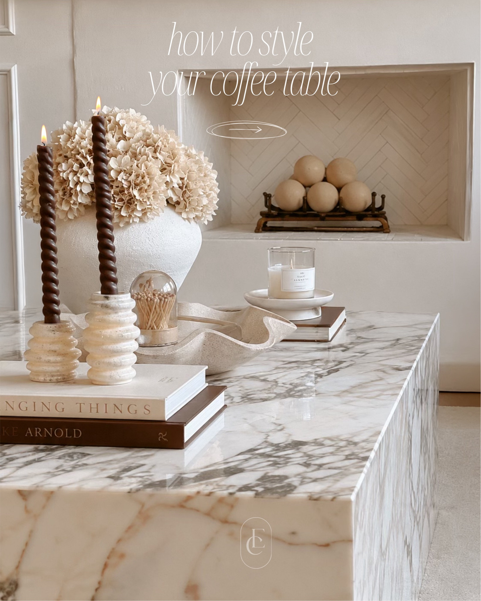 Coffee table styling is all about layering, not clutter. 🤍

A few thoughtfully chosen pieces can make your space feel elevated and collected. My go-to formula is simple:

• A stack of beautiful coffee table books
• Candlesticks for height and warmth
• Candle accessories for texture and function
• A sculptural bowl to create movement
• Faux hydrangeas for softness and life
• A timeless vase to anchor the arrangement

The key is mixing heights, textures, and natural materials while leaving enough negative space for everything to breathe. Simple, intentional styling always wins.

Which piece is your favorite? ✨ Save this for your next coffee table refresh.

#coffeetablestyling #homedecor #interiordesign #neutralhome #modernhome #coffeetabledecor #homestyling #interiorinspo #cozyhome #minimaldecor #livingroomdecor #decorinspiration #homesofinstagram #interiorstyling #homedesign

#LTKHome #LTKSeasonal