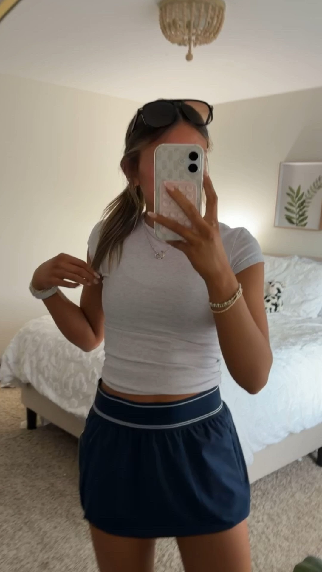 another outfit and cute view of this Walmart skirt! It is high demand, and selling fast!! Popular dupe to the Alo brand skirt- and for $9?! how could you miss it! I have this skirt in 2 colors- black & navy, both in an xs. They fit perfectly true to size. I am also wearing a tight t-shirt from garage, and tennis shoes, for a walk with my dog in the nice weather. Also linking one of my fav pairs of sunglasses from amazon, and my comfy shoes!! 

 #LTKSpring #Springfashion #LTKWalmart #Walmartfind #Alodupe #Springoutfitinspo #Athleticwear