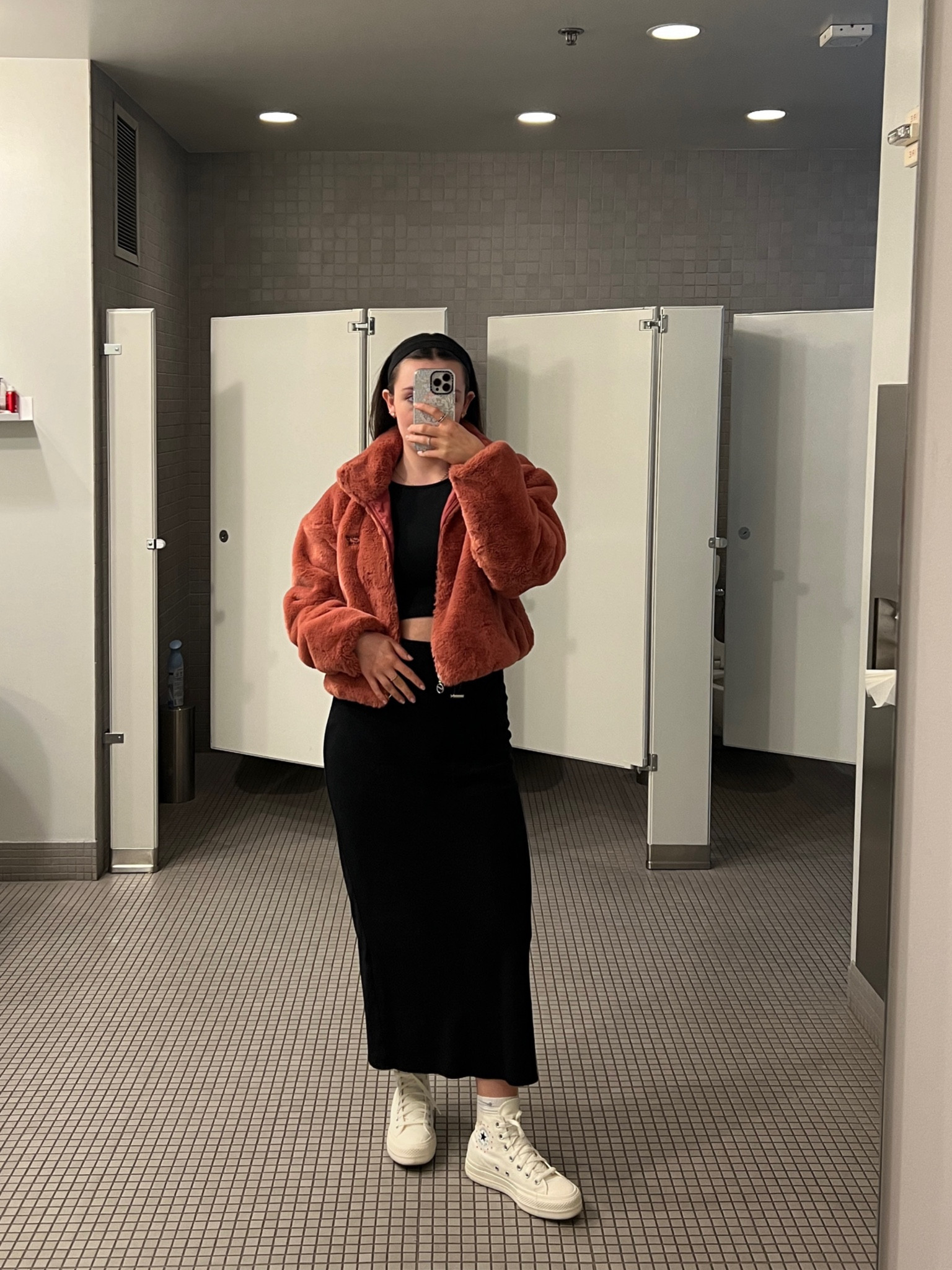 Puffy bomber jacket, Nike, converse, black maxi skirt, black crop top, headband, simple errand outfit

#LTKSeasonal #LTKActive #LTKstyletip