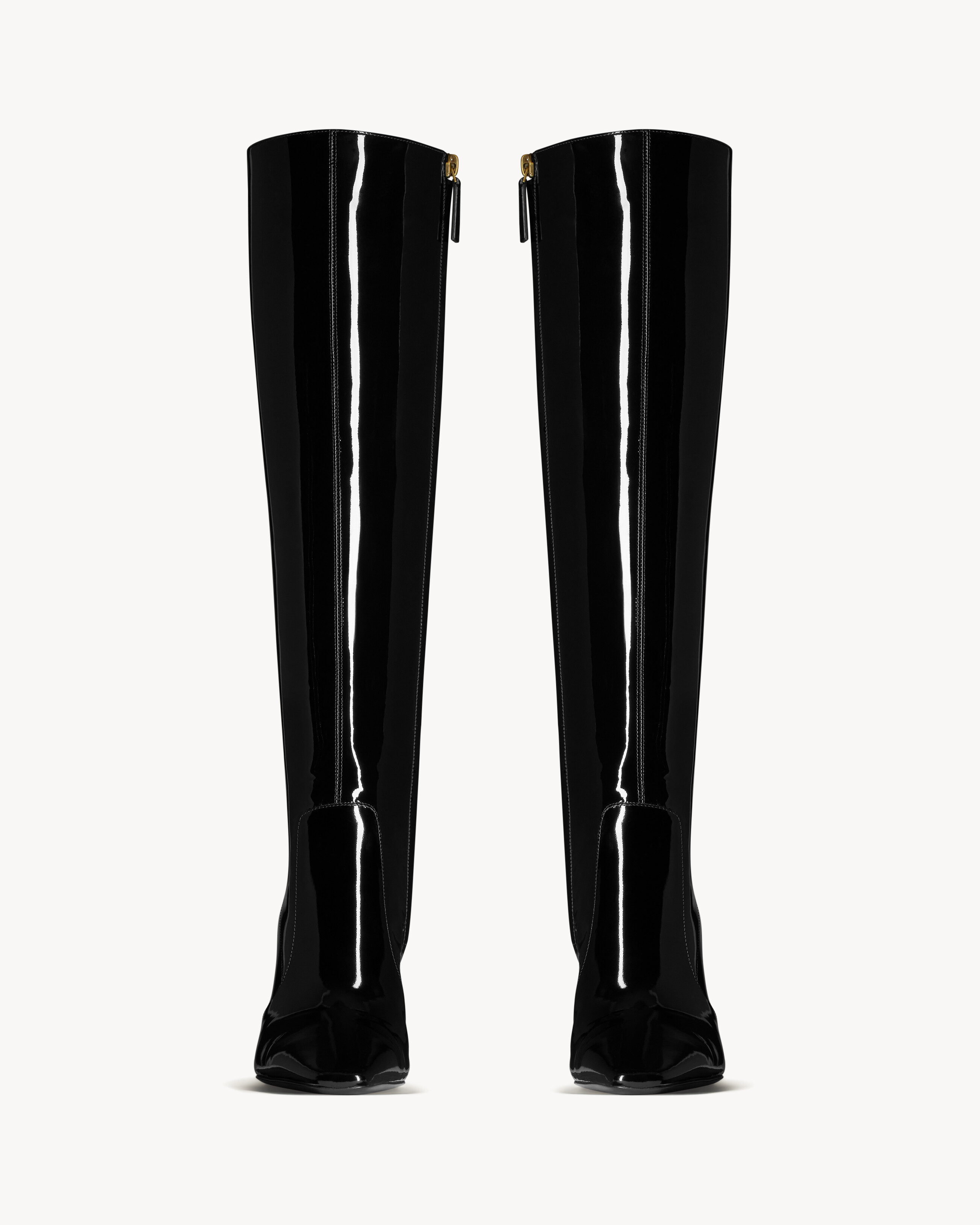 boots with a pointed square toe and covered heel, featuring a side zip closure. | Saint Laurent Inc. (Global)