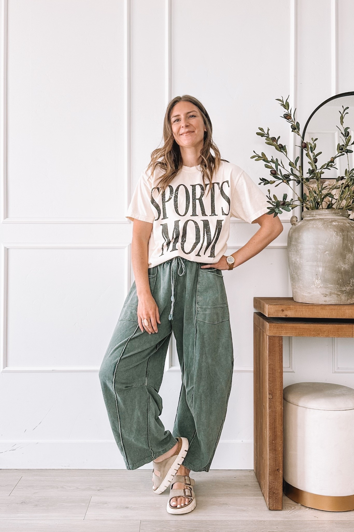 Sports Mom graphic tee with olive green barrel leg pants and platform sandals. Wearing a large in the tee for an oversized fit. I am 5’8” and typically a small so size up at least two sizes for this look. All pieces linked here.

#LTKgrwm #LTKootd #LTKmomlife