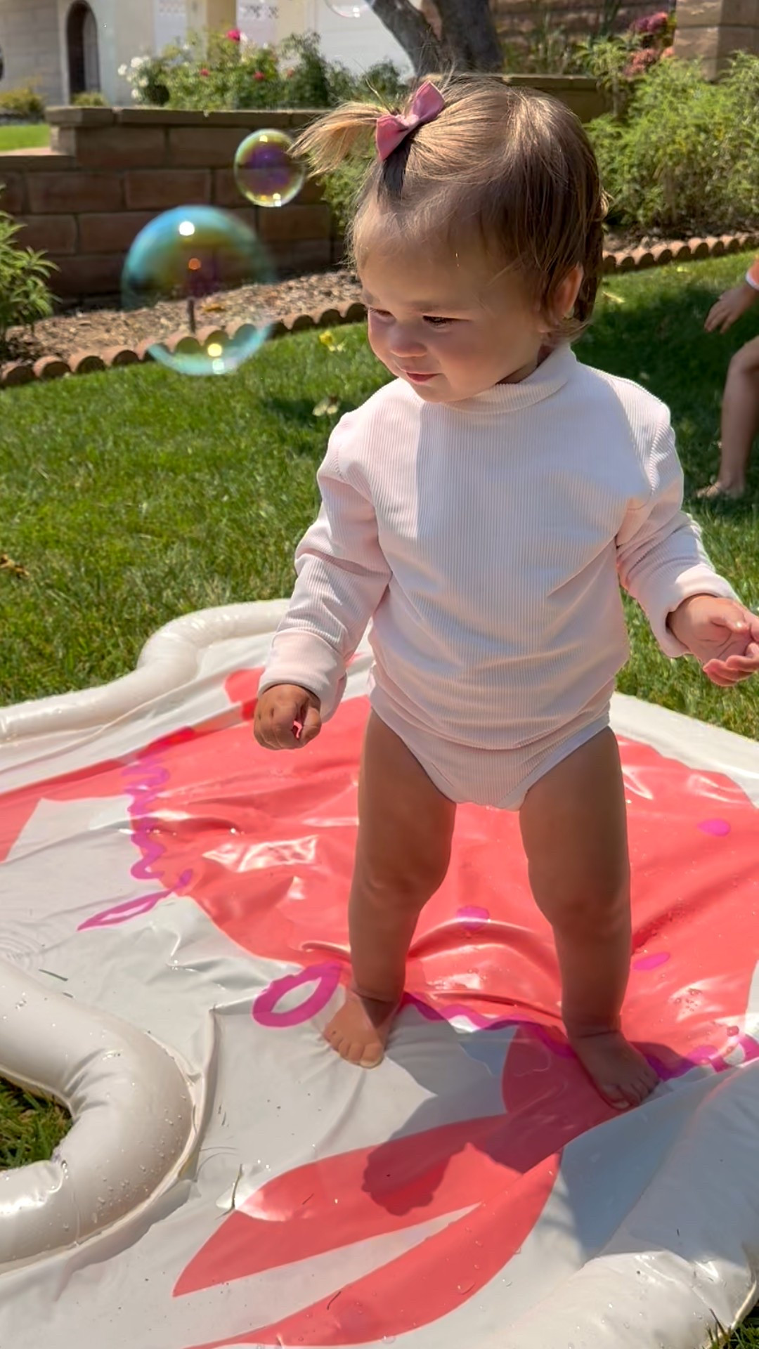 Splash pad & bubbles makes for a good combination 👏 🫧 
The girls are both wearing lain snow classic bathing suits. Banks is wearing an oversized hand me down, & Rell might be wearing what would be Banks’ size 😂

#LTKKids #LTKFamily #LTKSwim