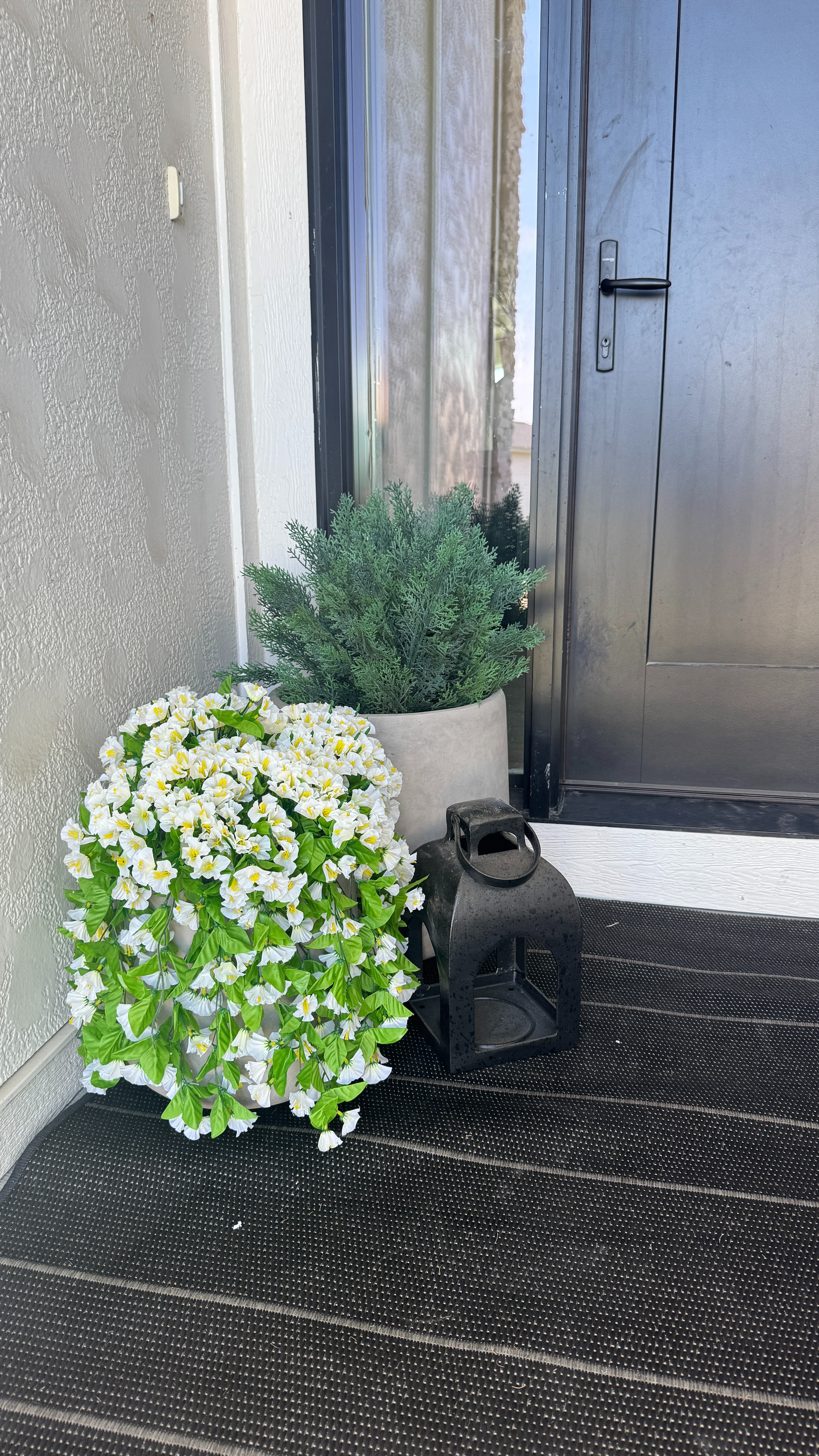Loving my front porch planters and faux greenery 🤍 Such an easy way to make the entry feel welcoming. 

 #LTKHome