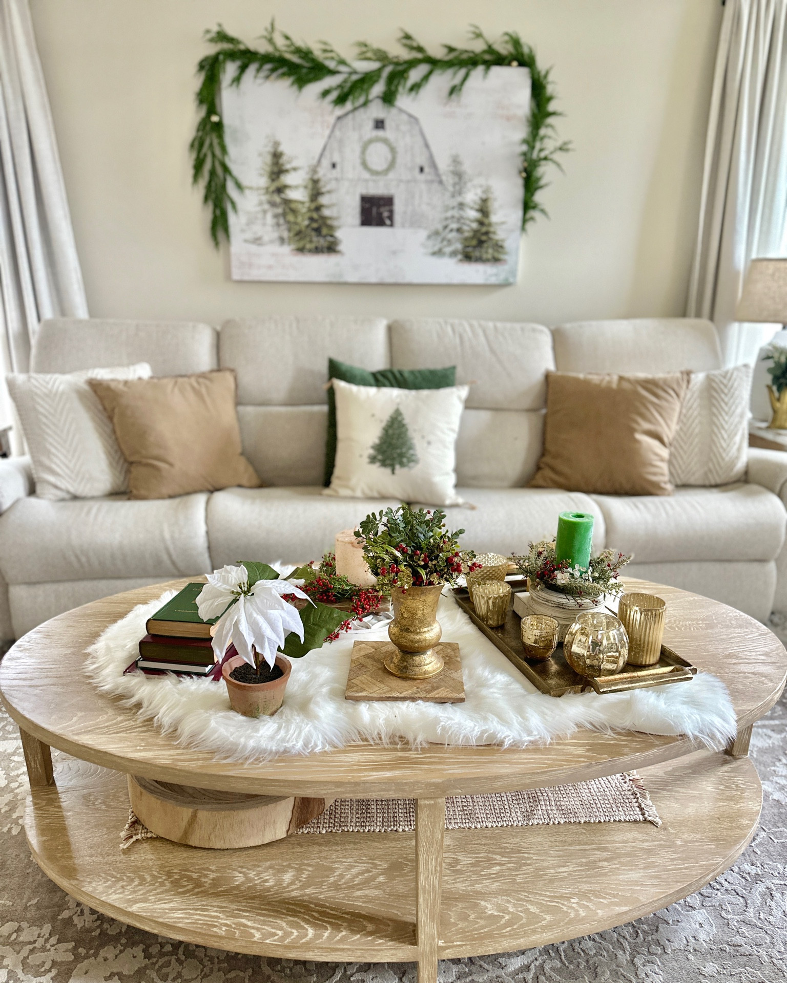 Faux fur sheepskin used as a table runner.  Christmas decor. Gold tray and votive candle holders. Christmas coffee table decor. Winter print. Christmas print. Throw pillows. Poinsettia

#LTKHoliday #LTKCyberWeek #LTKHolidaySale