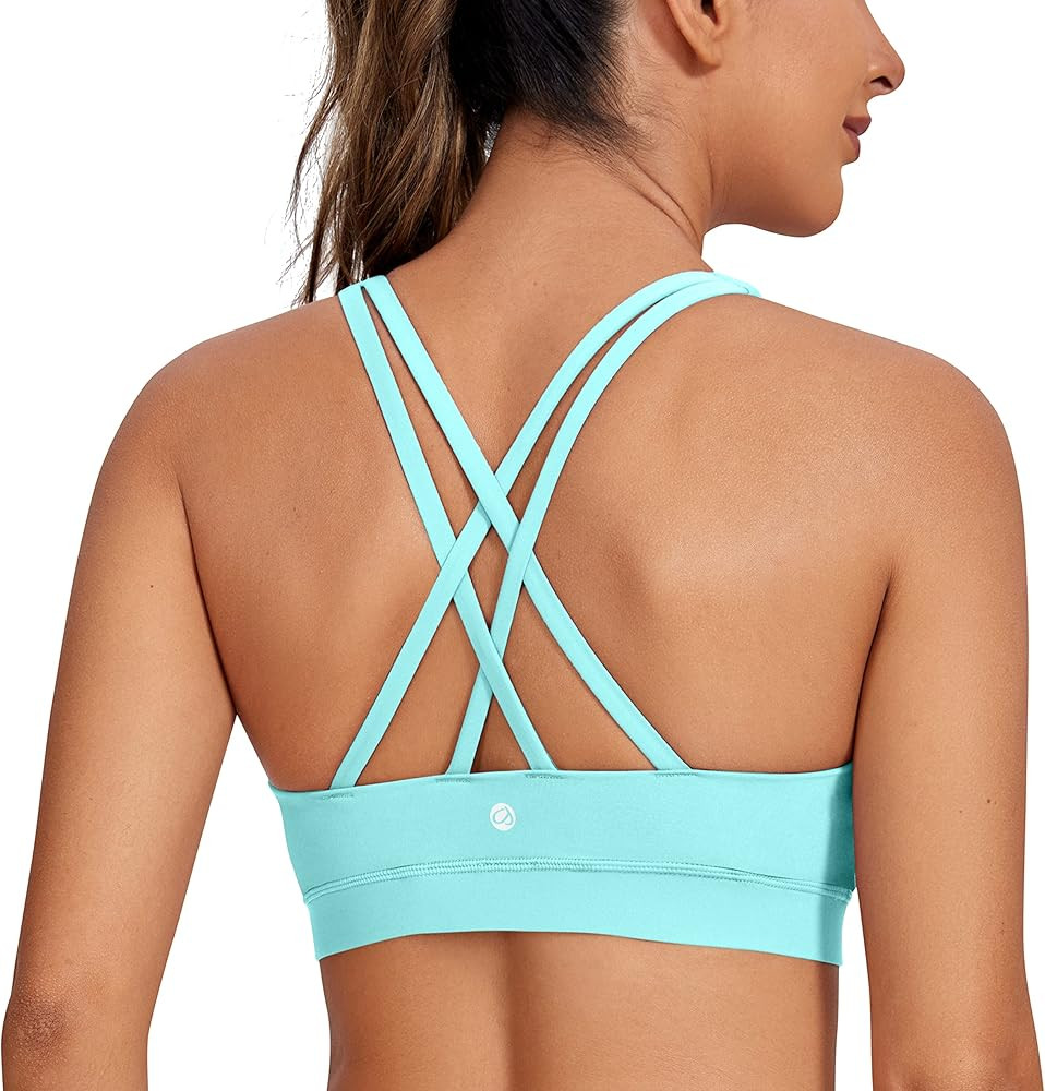 CRZ YOGA Women's Strappy Sports Bras Fitness Workout Padded Yoga Bra Criss Cross Back | Amazon (US)
