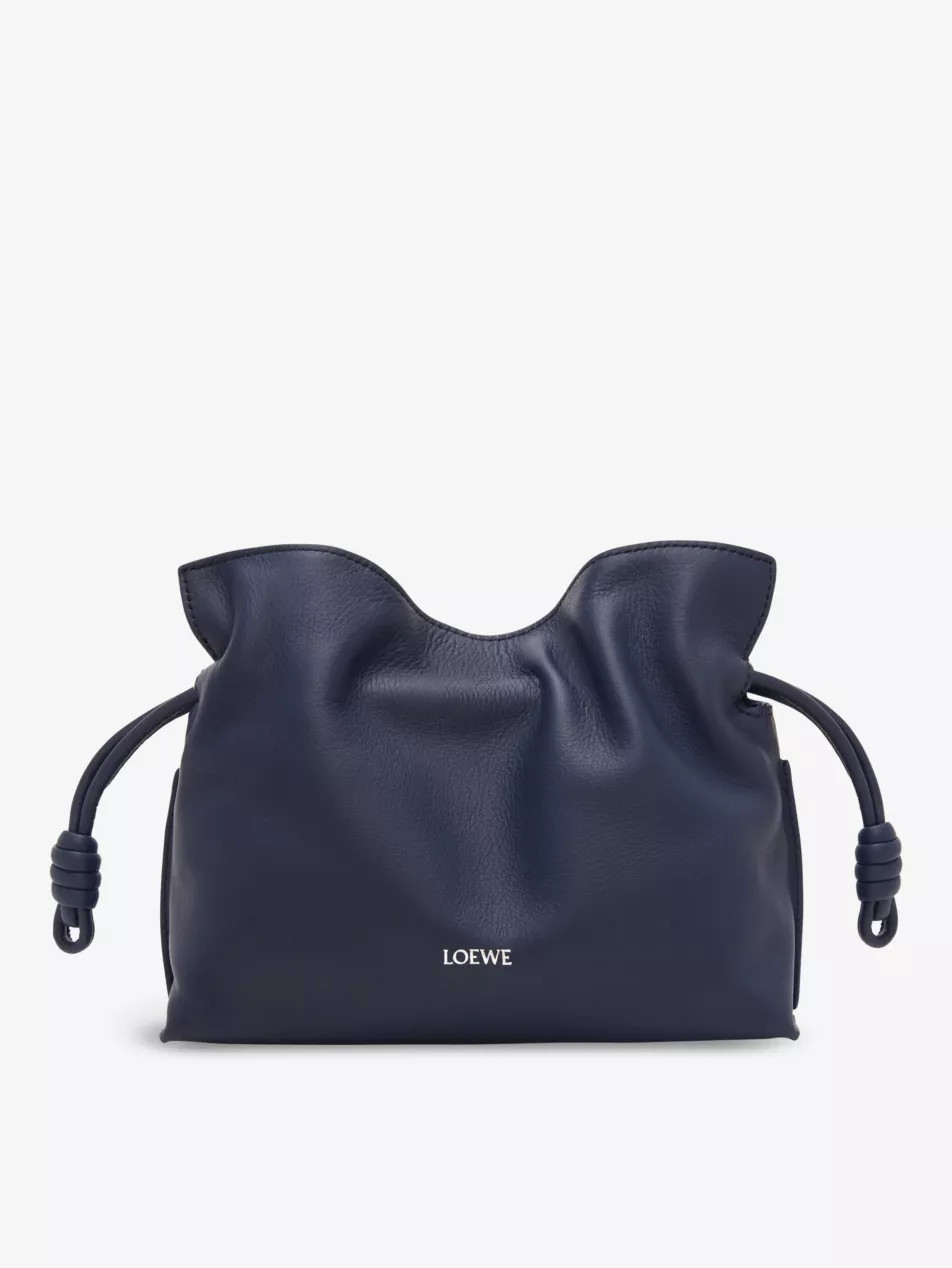 Flamenco logo-embossed mini leather clutch bag | Selfridges