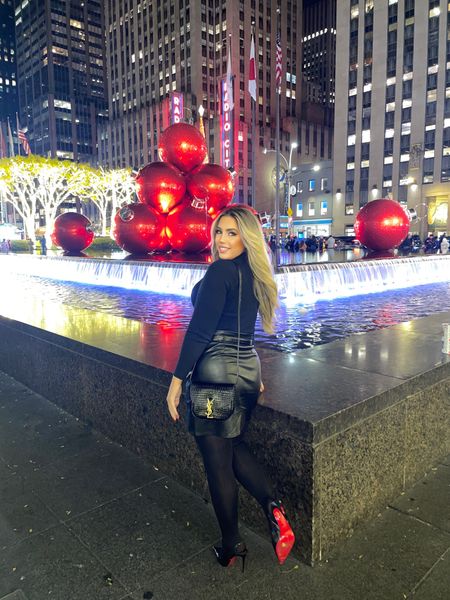 I am so ready for the holiday season! I had an amazing trip to NYC this past week and saw all of the Christmas decorations up already. Wearing my new Ysl Kaia bag, matching YSL belt, and Louboutins. The red bottoms matched the holiday decor perfectly! What is on your Black Friday shopping list? Comment below! 

Date night
Christmas 
Holiday outfit
Holiday party 
New York City 
City outfit 
All black outfit 
Luxury accessories 

#LTKshoecrush #LTKHoliday #LTKSeasonal