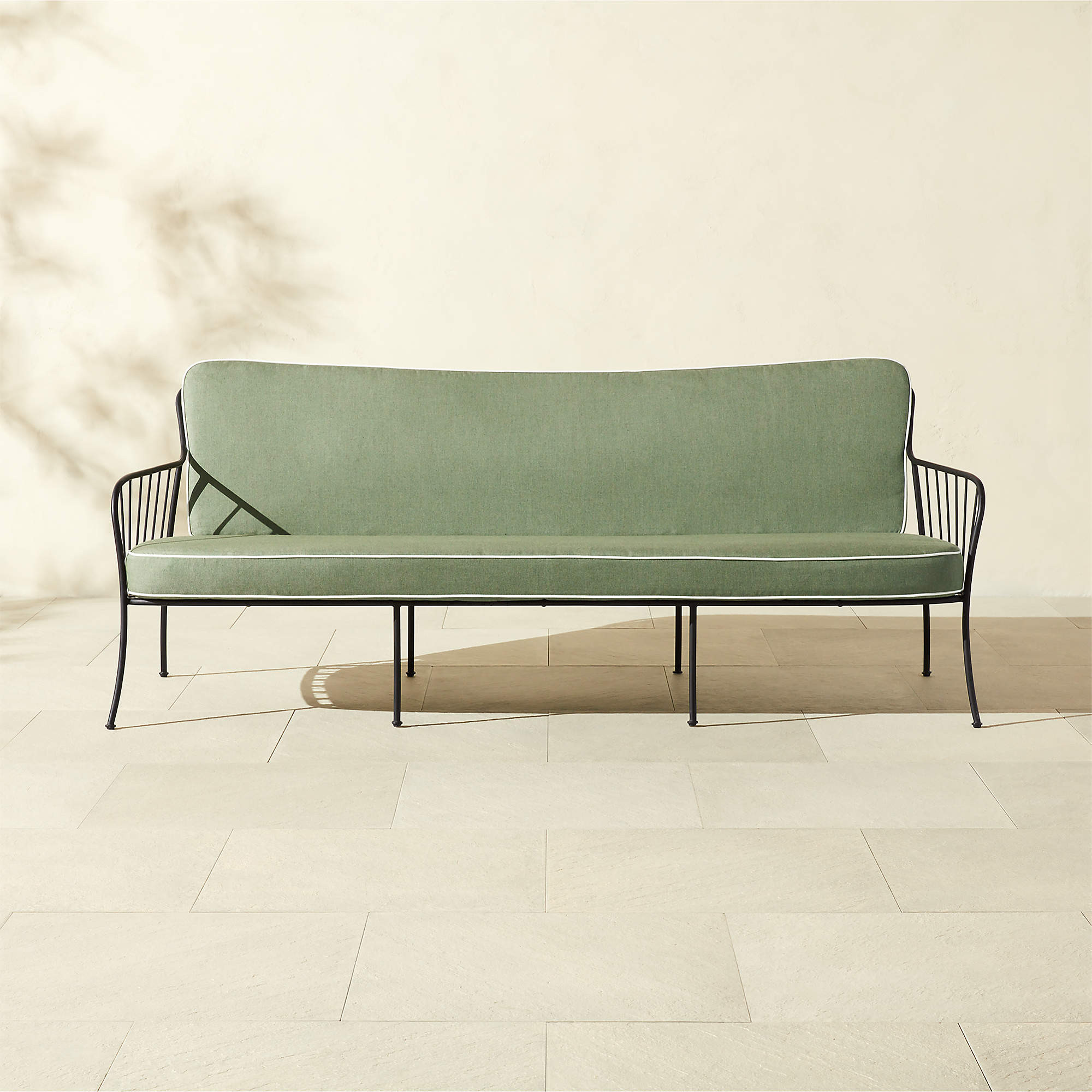 Welling Black Metal Outdoor Sofa with Green Sunbrella Cushions | CB2 | CB2