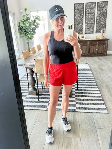 Love these Lululemon red running shorts with a black crop top aloe hat, and Nike sneakers. Size 6 in the shorts and size small in the tank. Sneakers run true to size.

#LTKSeasonal #LTKFitness #LTKStyleTip