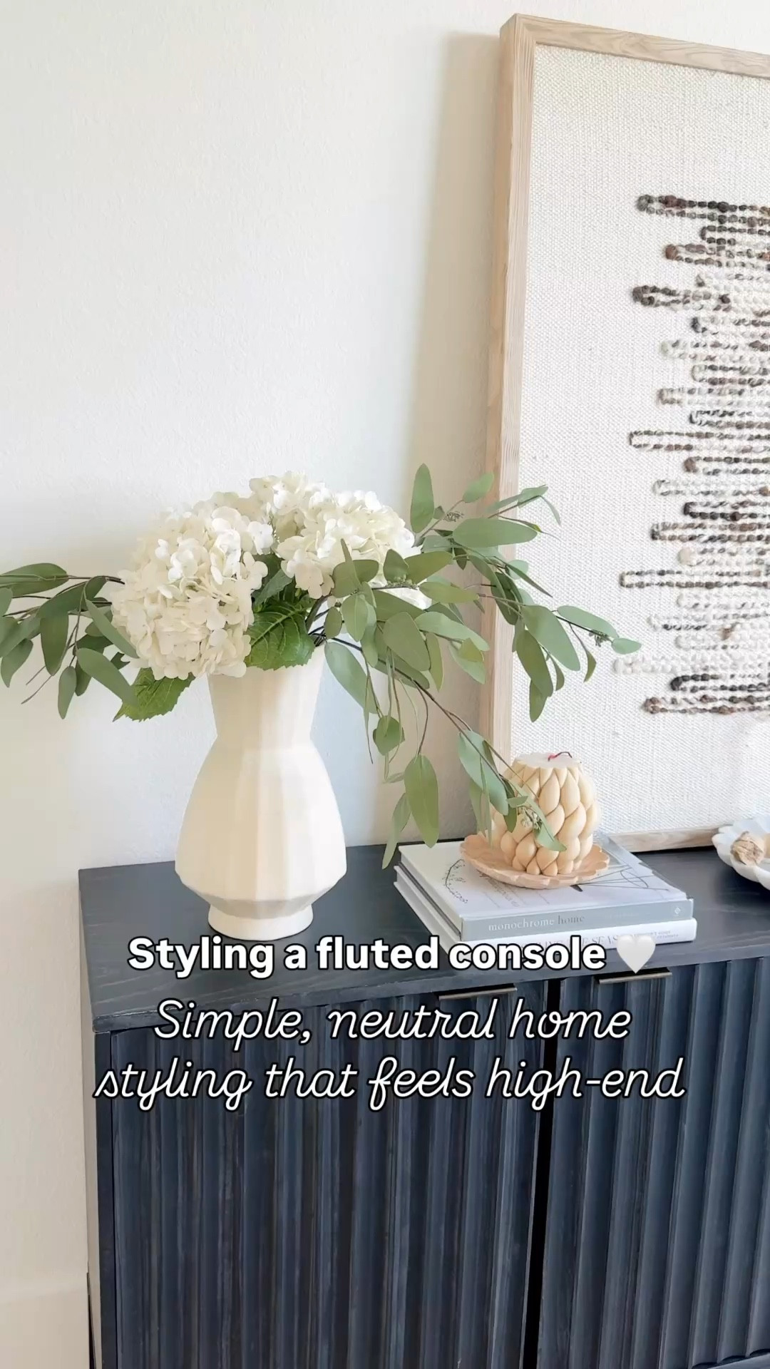 Console table styling ideas that instantly make your space feel finished 🤍 I love mixing neutral decor, layered books, and organic textures like this fluted console + woven wall art for a high-end but still cozy look. Console table styling with spring florals  Everything is styled to feel simple, elevated, and lived-in without overdoing it. Follow me on LTK for daily home decor, Amazon finds, and styling ideas.

#LTKHome #LTKSaleAlert