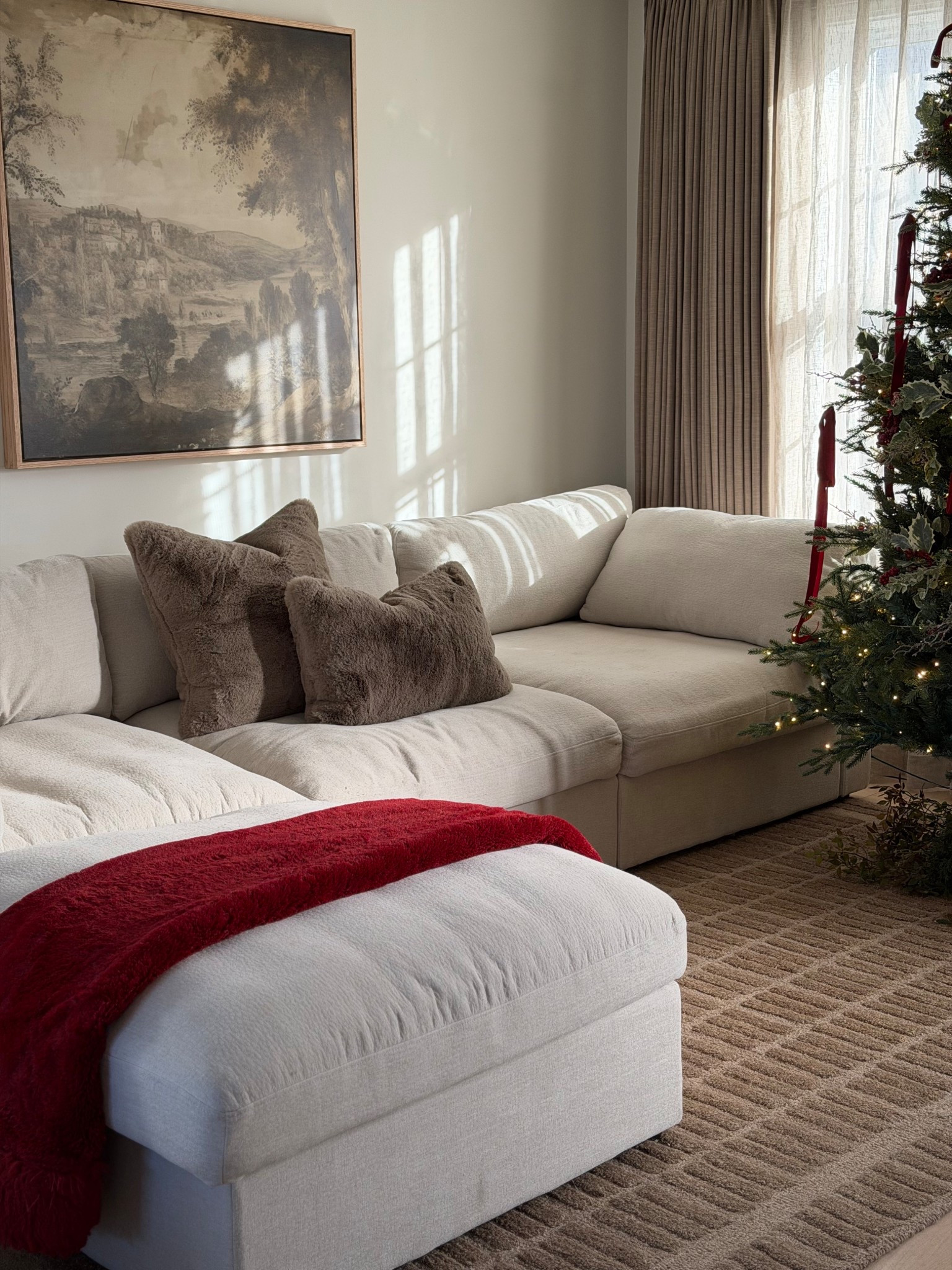 cozy Christmas living room.

twinkle tree, beige couch, sectional sofa, neutral rug, loloi rug, red christmas, red bow, faux fur pillows 

#LTKHome #LTKFindsUnder100 #LTKHoliday