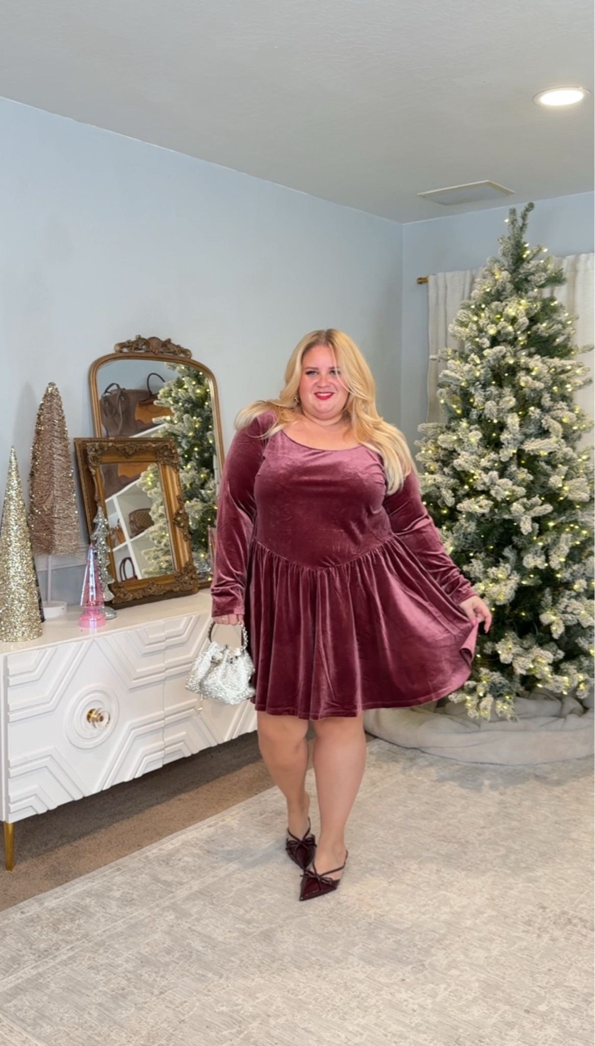Velvet makes every holiday outfit look richer, and this one is zero-effort.

This dress drapes perfectly, doesn’t cling to the midsection, and has that soft, expensive look without the price. Paired it with bow heels and a pearl mini bag for a cute party vibe.

Dress size XXL
Heels true to size

Easy, comfortable, and festive.

#LTKHoliday #LTKFindsUnder50 #LTKPlusSize