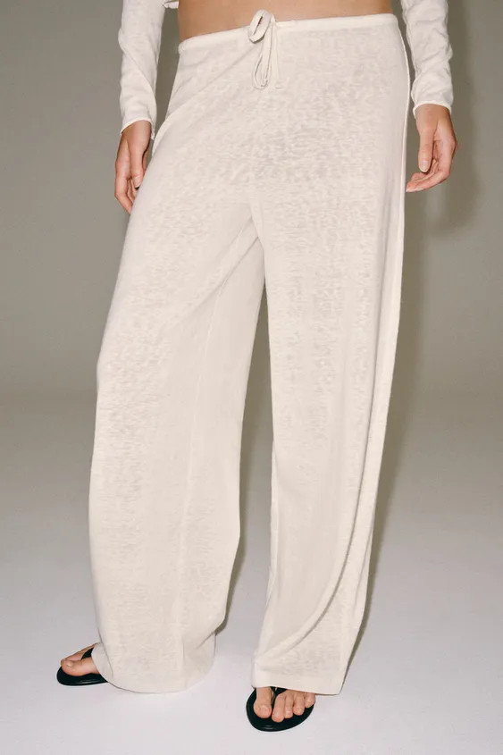 Model height: 179 cmTrousers made from a cotton blend yarn. Featuring a mid-waist, an elasticated... | Zara UK