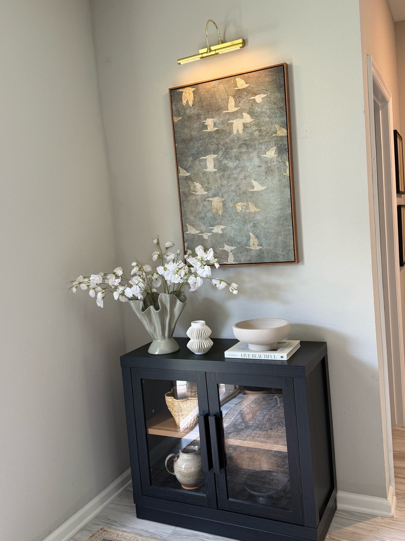 Moved this beautiful pottery barn inspired wall art to my entryway! My Walmart cabinet is also back in stock 🔥 

Small entryway, Walmart home finds, Amazon home finds, designer inspired home finds, console styling, pottery barn look for less home finds

#LTKHome #LTKSeasonal