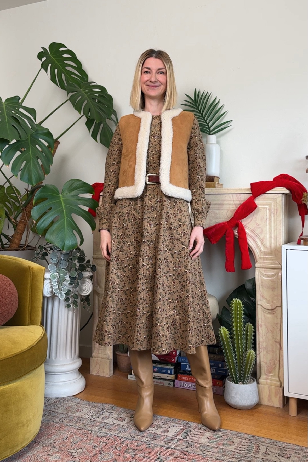 Cozy sheepskin vest paired with a soft cord dress in ditsy floral and elegant leather knee high boots. This outfit is great for everything from work to meeting friends! Comfy and fun everyday look 