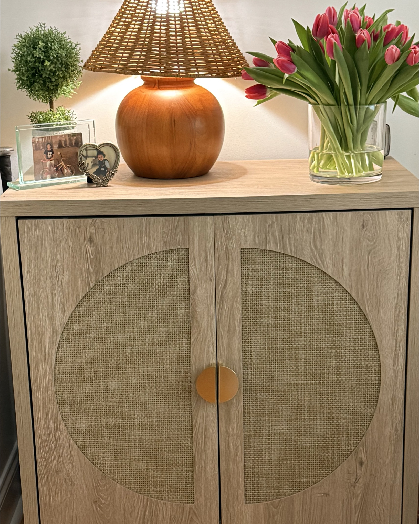 Neutral, cozy, and quietly elevated ✨
This little corner is all about warm woods, natural textures, and simple styling—proof that you don’t need a full room makeover to make your space feel pulled together. The woven lamp, light wood cabinet, and fresh florals instantly add warmth and softness without trying too hard.

I’ve linked everything you see here so you can recreate this look in your own home 🤍
Tap to shop + save for later.

#LTKHome #LTKValentine #LTKdayinmylife
