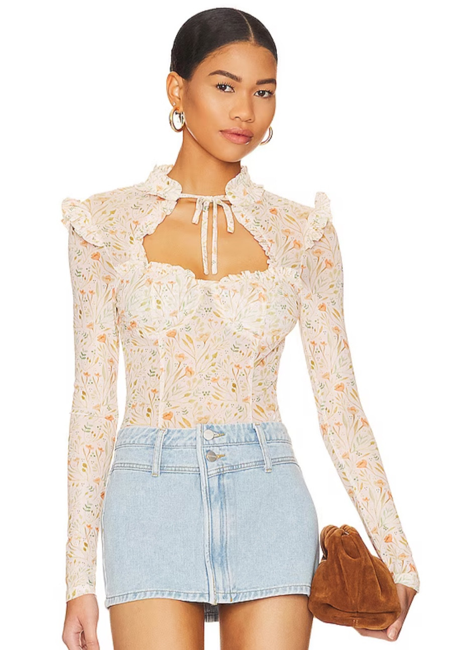 How stunning and feminine is this top for spring and summer from Revolve. Love it with a skirt or shorts and heels for a girls night or date night or anytime.  Obsessed . #springtop #revolve 

#LTKSpringSale #LTKfindsunder100 #LTKmidsize