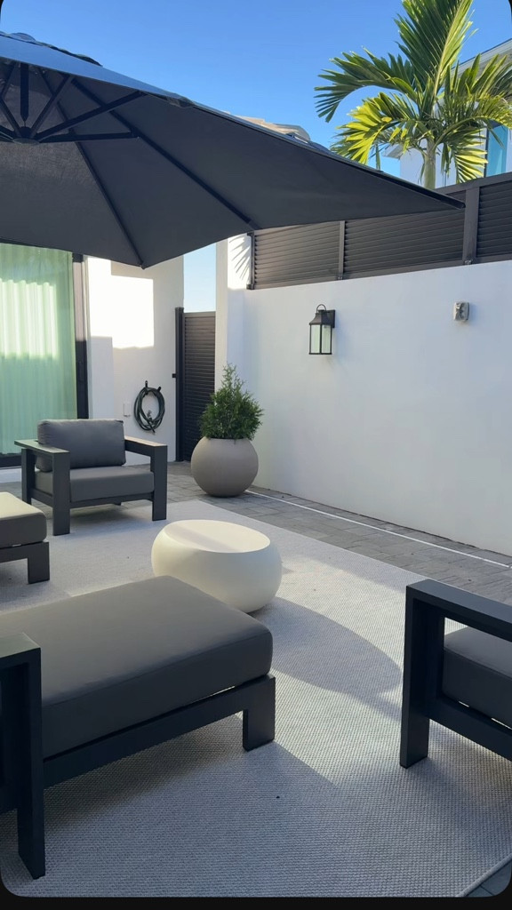 outdoor patio is coming together !

Florida 
Coastal 
Modern 
Gray rug 
Gray patio furniture 
Outdoor couch 
Outdoor chair 

#LTKGiftGuide #LTKCyberWeek #LTKHome